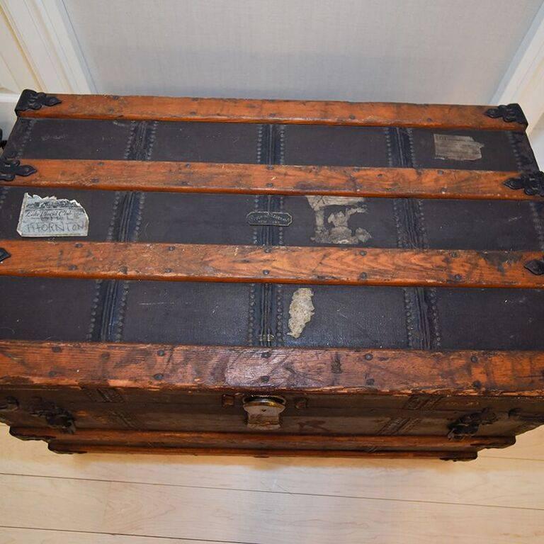 This Crouch & Fitzgerald trunk is from the late 19th century with initials, original interio labels and exterior metal plate. It is well weathered.