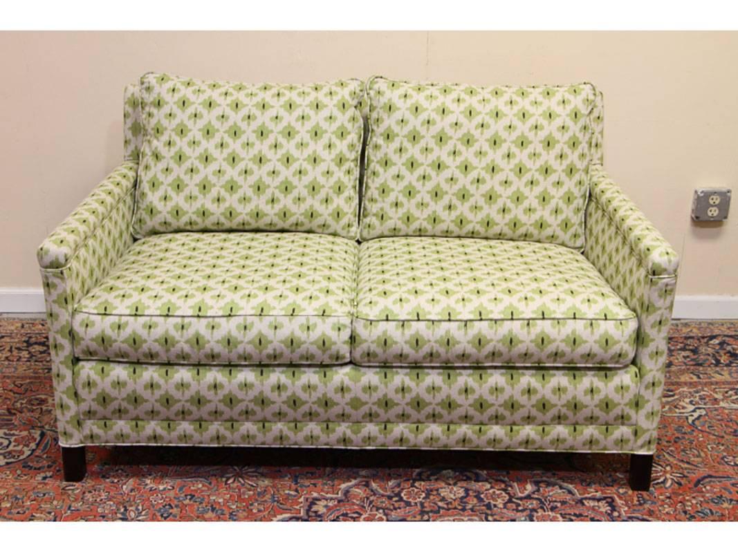 Subtle green Ikat pattern with custom coordinating pillows. In very good condition. A quality cottage type sofa , very solid and comfortable.