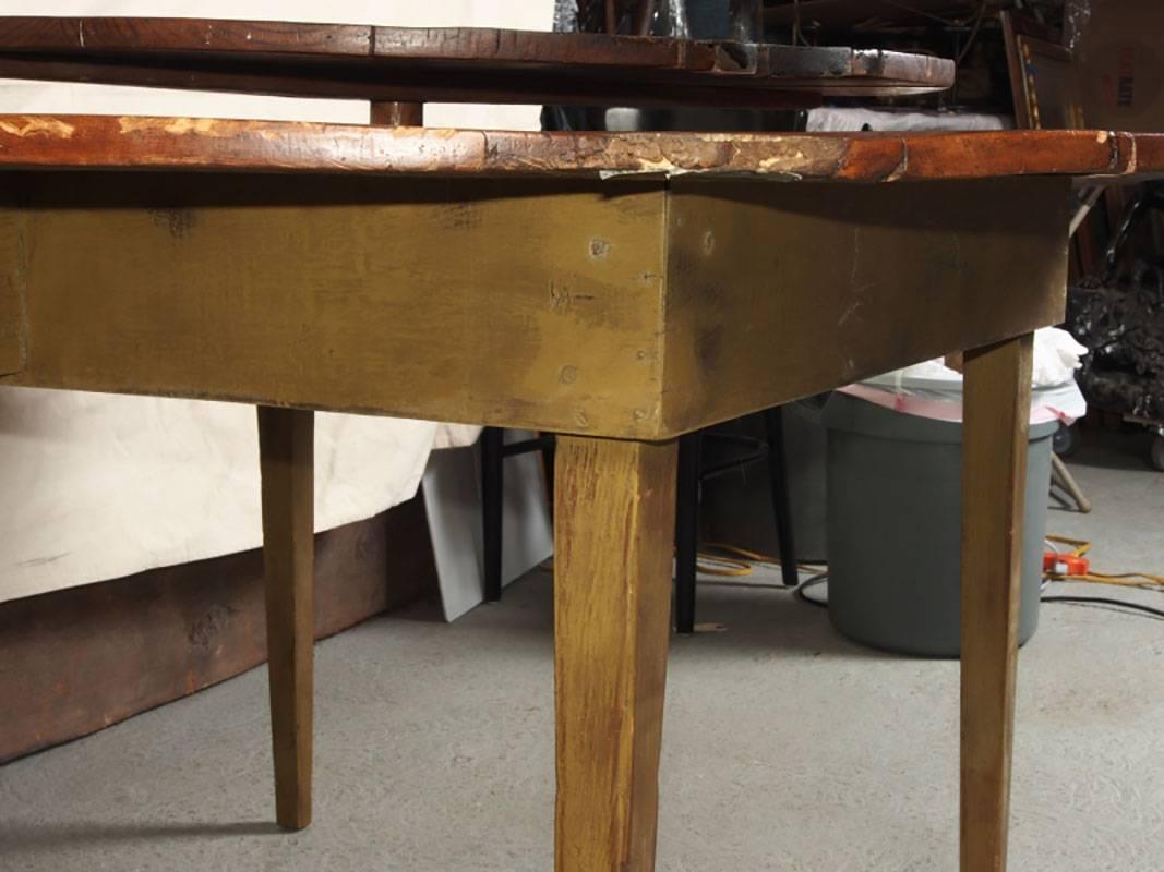 Table with planked construction, four tapering legs, rotating lazy susan center. The base is later than the top and well done
Measurement: 60