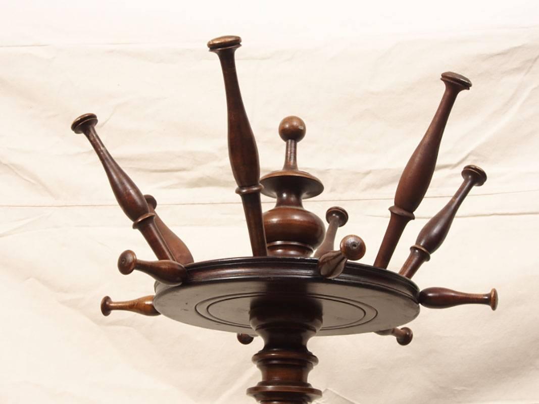 Victorian umbrella and coat rack with zinc pan, rotating top, peg construction, bun feet.
Condition: The stand is slightly crooked (please see Photos) , with one repaired peg, some losses consistent with age and use with the Stand presenting well. 