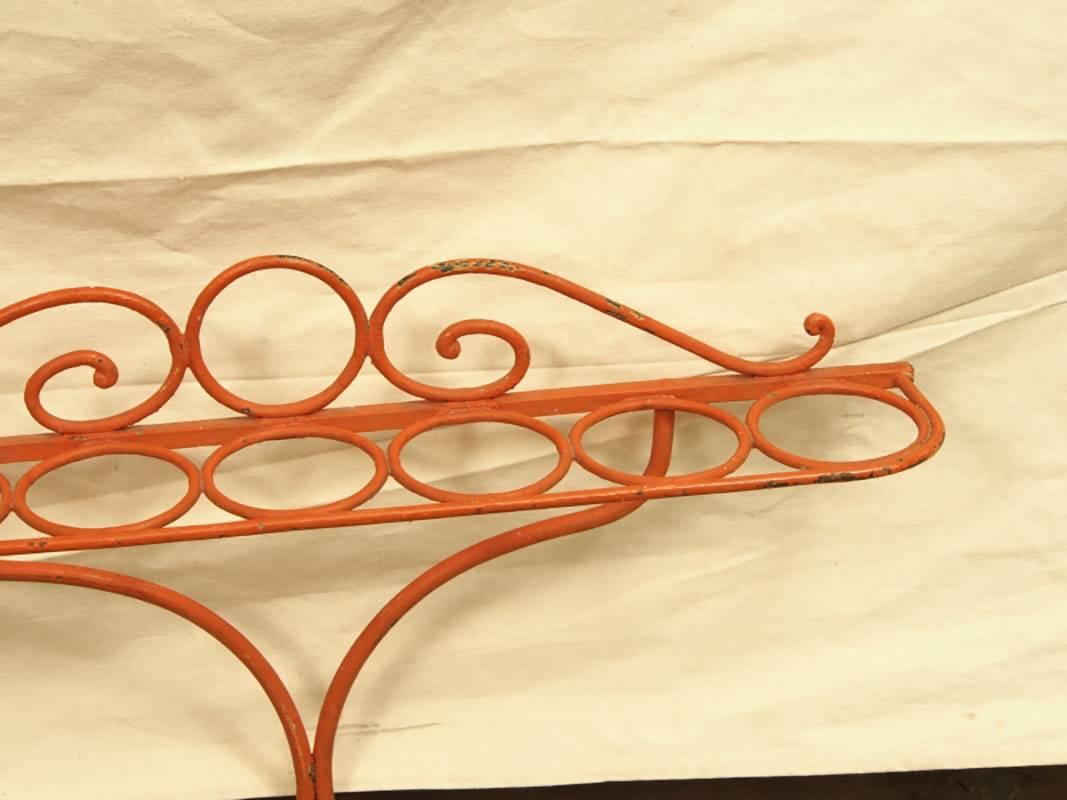 Not seen too often, this long Antique Iron Cane and Umbrella holder is painted in a striking Orange. Paint decorated heavy wrought iron Stand in bright orange with 14 compartments for canes or umbrellas.
Condition: The Stand is  missing the drip 