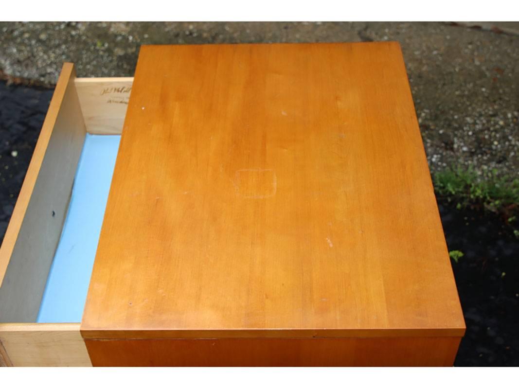 Maple construction with single cone shaped brass pulls. Angular tops with splayed legs and a single drawer.
Condition: Some light to medium wear on tops including some storages and minor scratching.There is light blue contact paper on the drawer