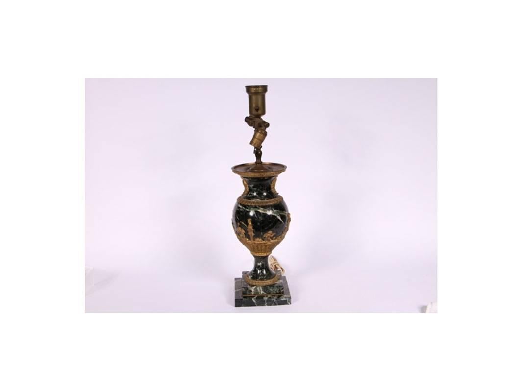 A beautiful neoclassical style three-bulb lamp in urn form variegated marble with figural and neoclassical bronze mounts on footed square marble base.
Condition: Working but should be re-wired.