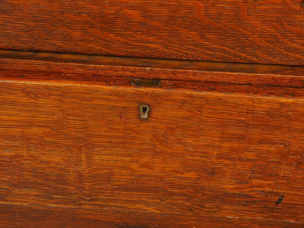 Although there is no label, we believe this may be an authentic Stickley chest. Oak two-tiered with mirrored splash back, top shaped shelf and squared supports. The case with a single frieze drawer over one long drawer and flanked by twin