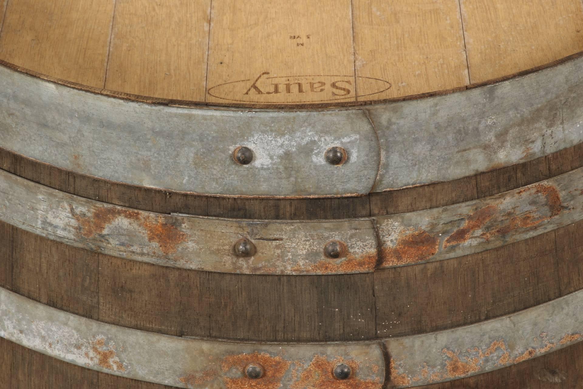 Vintage oak wine barrel with metal strappings. Rubber stopper included where lead photo shows hole. Top marked Saury, France.