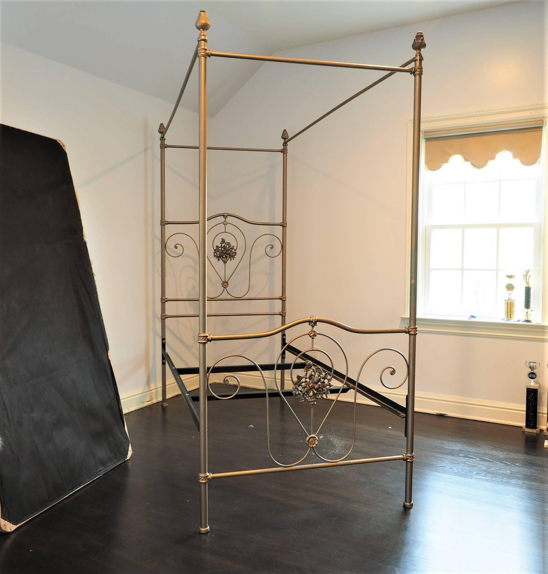Vintage iron twin bed with delicate scroll work and fruit basket castings on head and footboard, well made and very sturdy. The mattress is shown for photography purposes only and is not included.