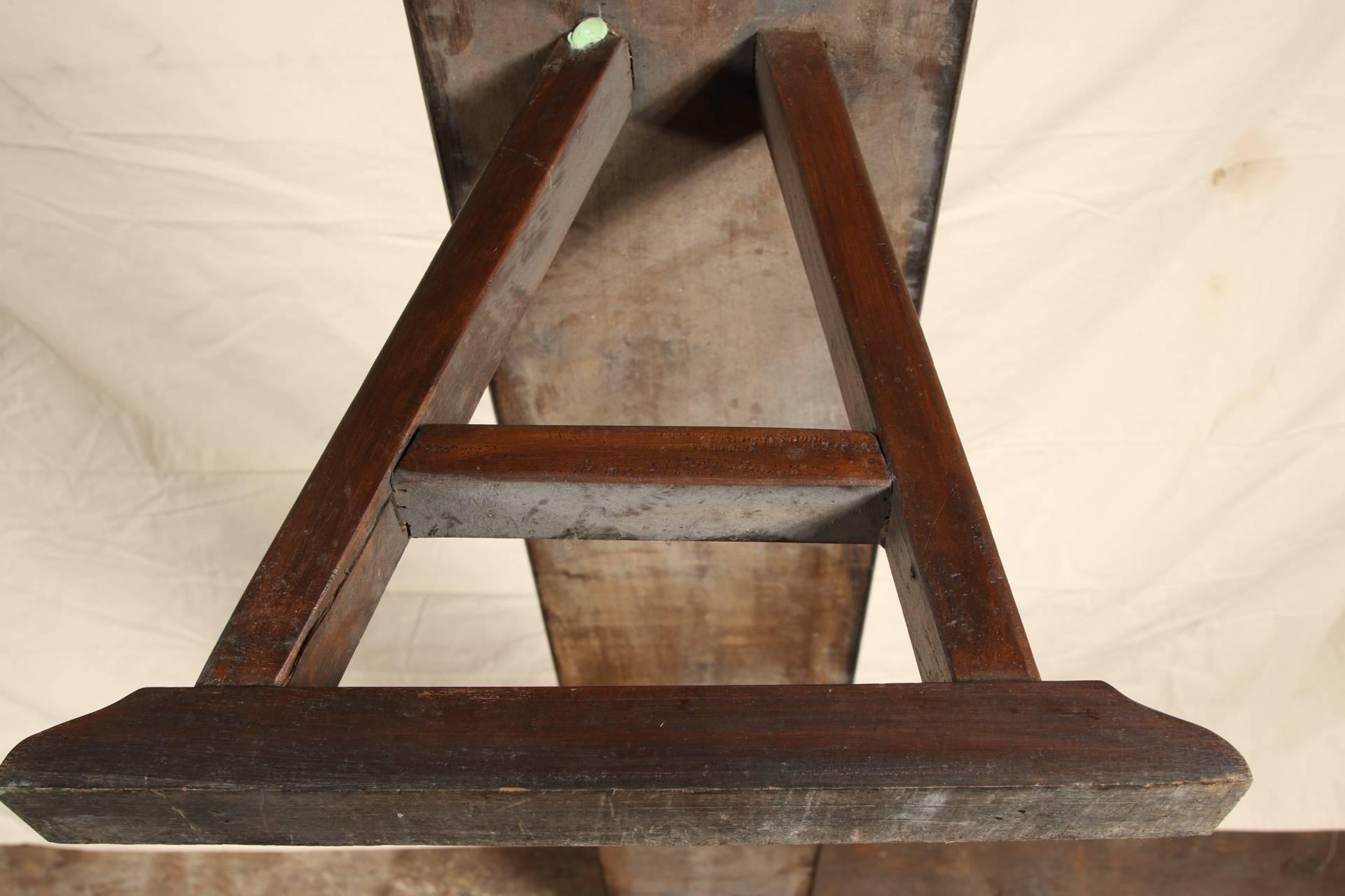 Heavy Chinese carved hardwood vintage bench having triangular supports and peg construction.
Condition: good.