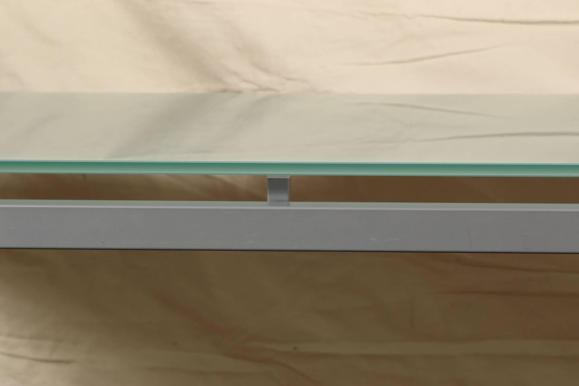 Rectangular brushed chrome frame with raised supports for the frosted green glass top on the reverse.
Measure: Glass is 1/2 inch thick.
Some very light scratches to glass top, does not detract from the table.