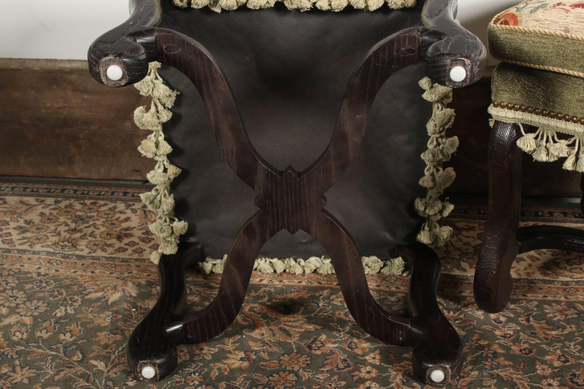 Heavy oak construction with cabriole legs ending in incurved feet and shaped X-stretchers. Upholstered in sage green velvet with fringe and 18th century tapestry covered tops depicting fruit and flower baskets on a foliate field. 
Condition: some