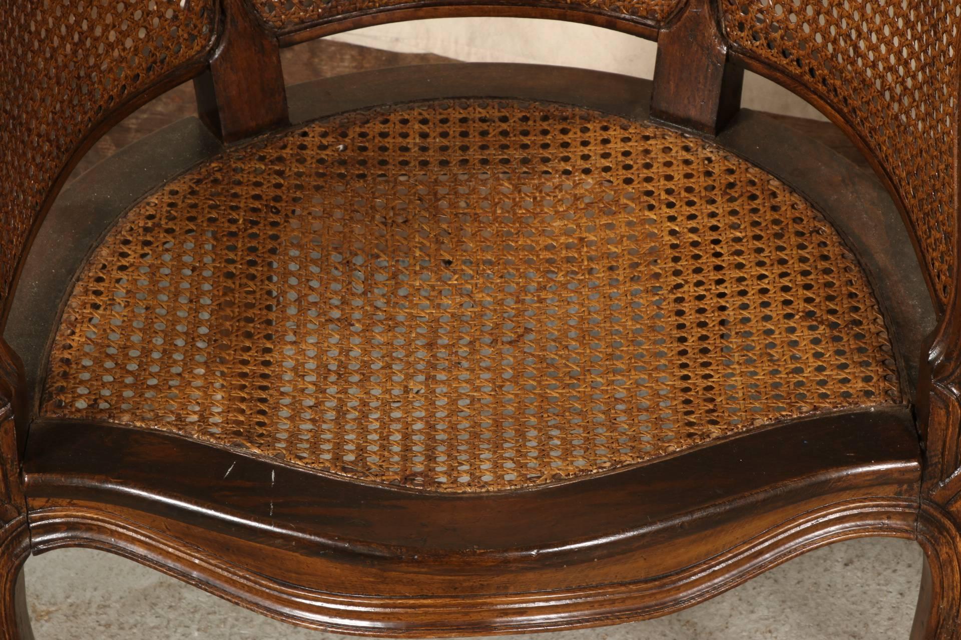 20th Century Pair of Caned Walnut Stained Bergeres