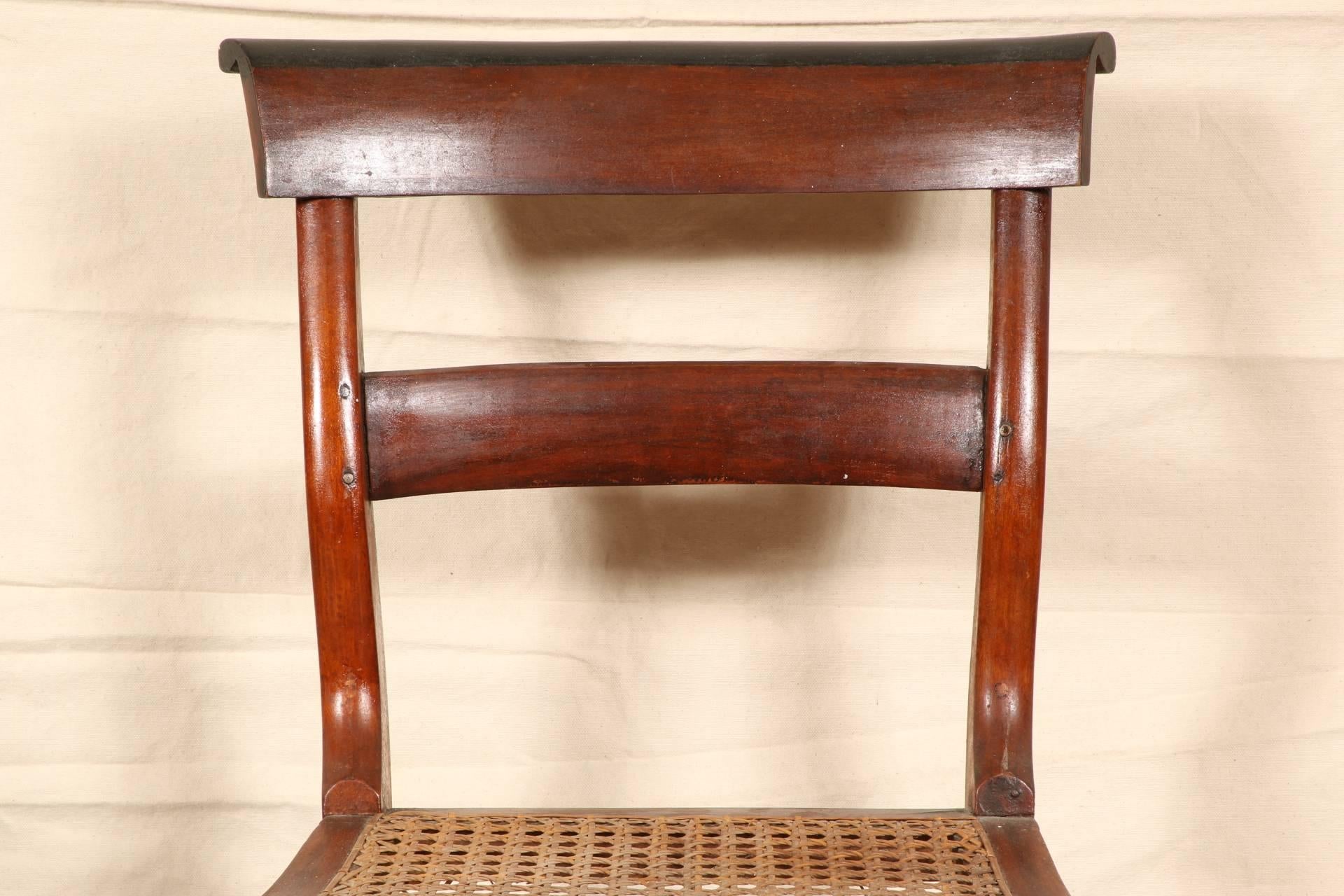 In brown with ebonized crest rails and caned seats, double side stretchers and single ones front and back.
Condition: Good overall with some wear to the finishes.