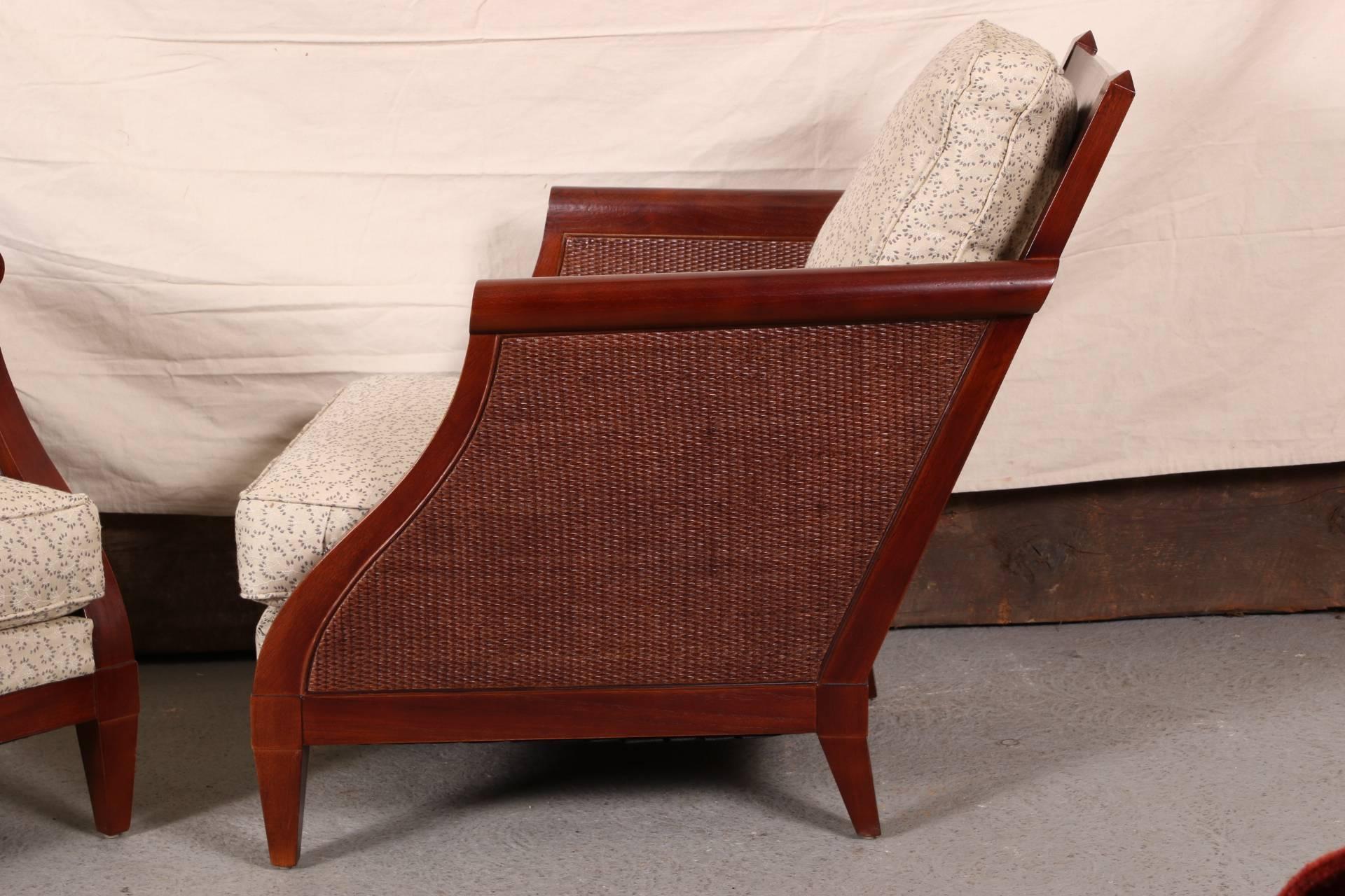 Mahogany with sloping slatted backs and shaped and woven rattan sides. Raised on square tapering legs. With gray on beige upholstery.
Condition: a few scrapes to the lower frame front edges.