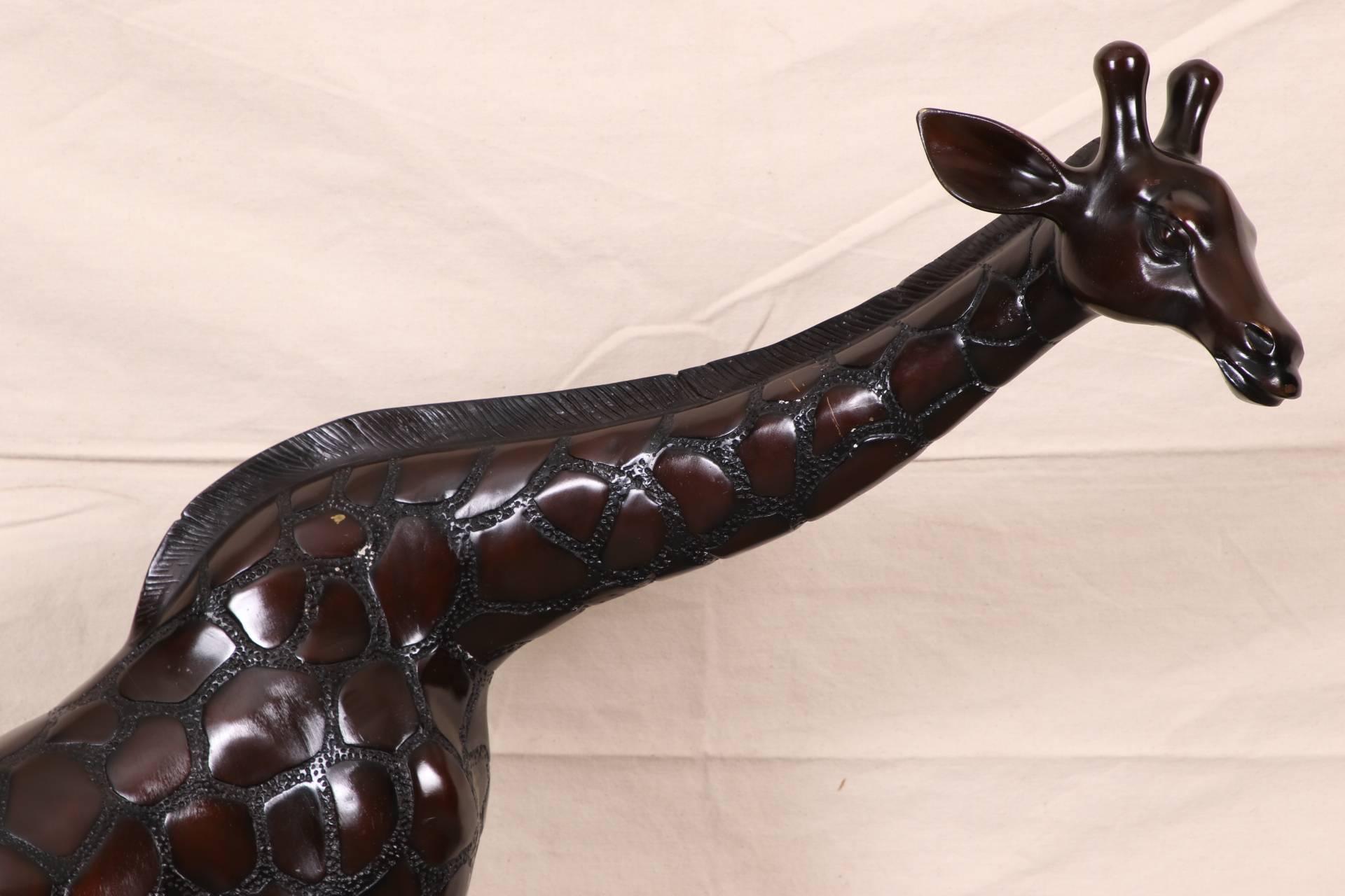 Large form cast bronze giraffe with two-tone finish. With finely patterned hide. 
Condition: some losses to the finish.