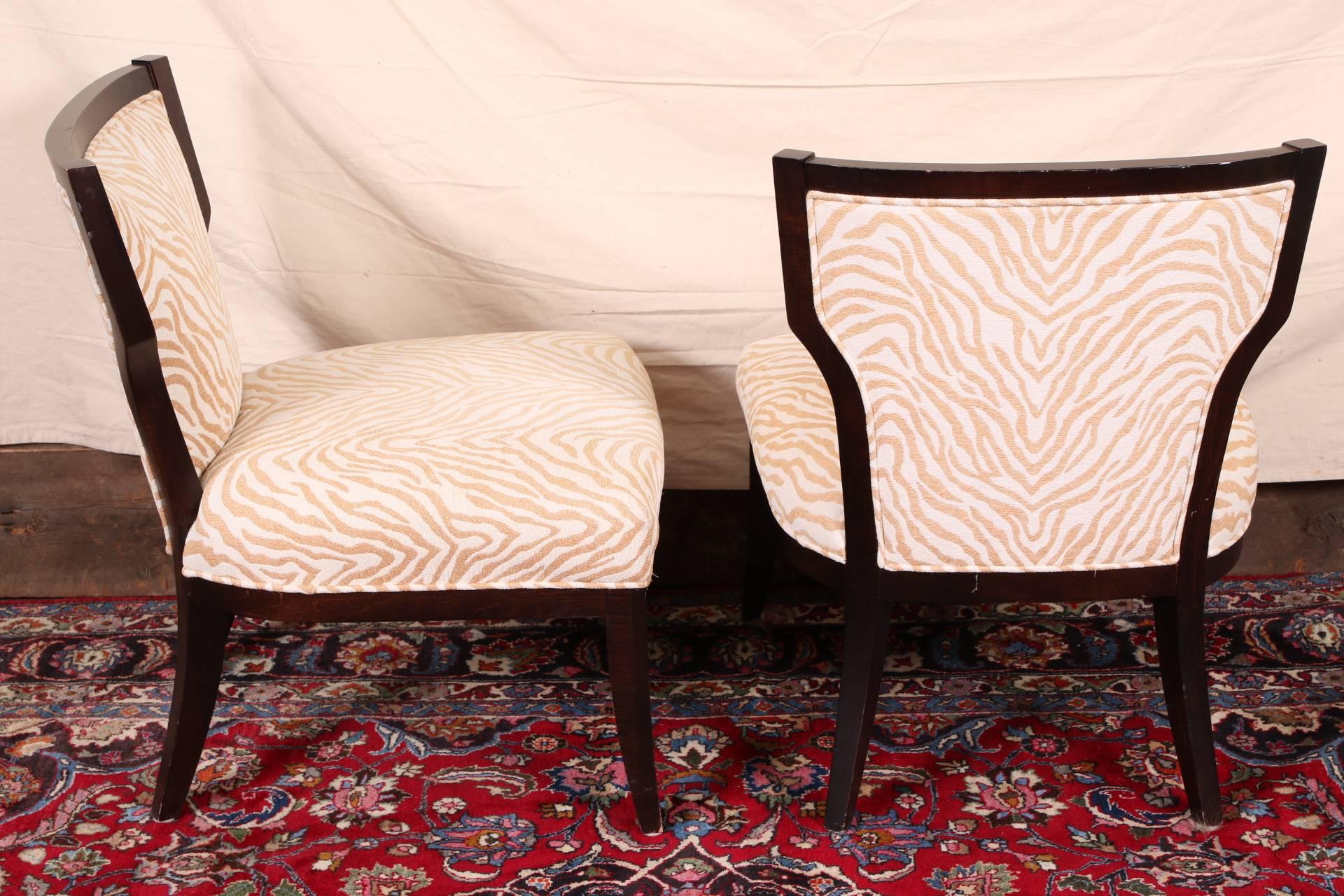 Modern pair of chairs in klismos style with a brown and white zebra print fabric and dark brown stained frames. Sold by Lillian August.
Condition: a few scrapes to the legs.