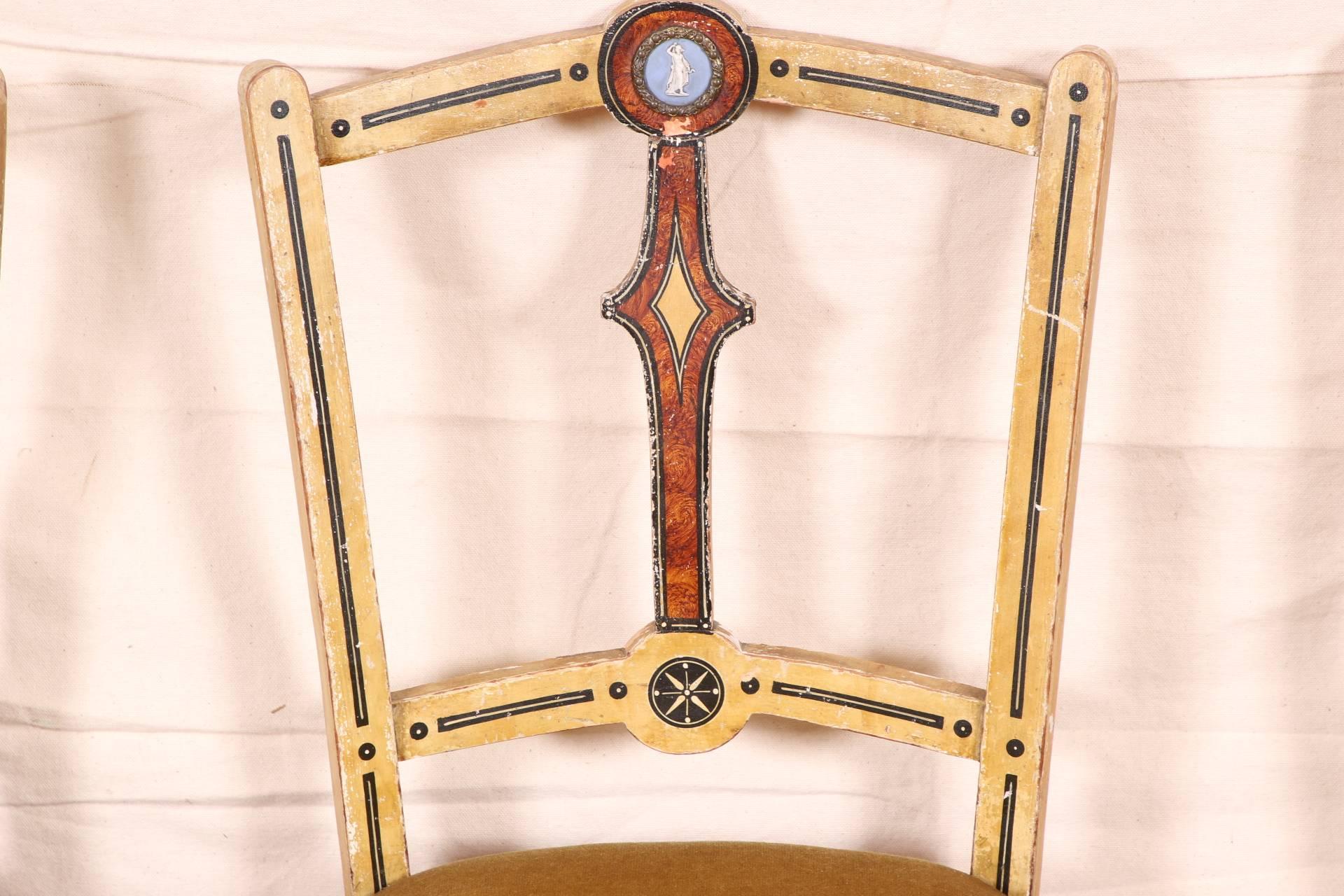 In cream paint with black details, the vertical splat in a faux tortoise finish with silver framed blue and white jasperware roundels with neoclassical female figures. With a turned front stretcher, double side stretchers, and a single one in back.
