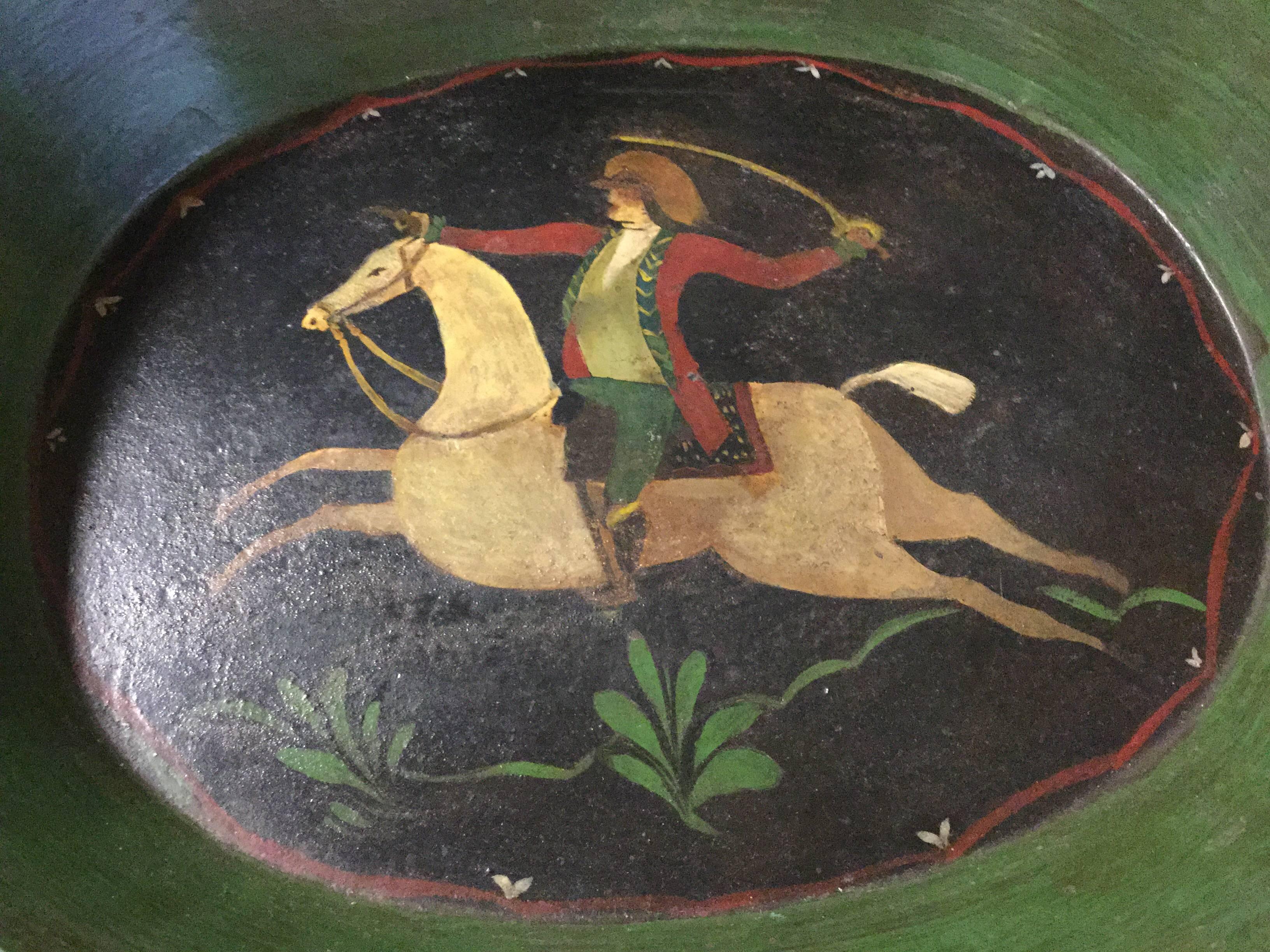 A very decorative antique French handled tray depicting a sword wielding soldier on a charging horse. In very good, all original condition, with vivid paint and all-over fine age patina. 