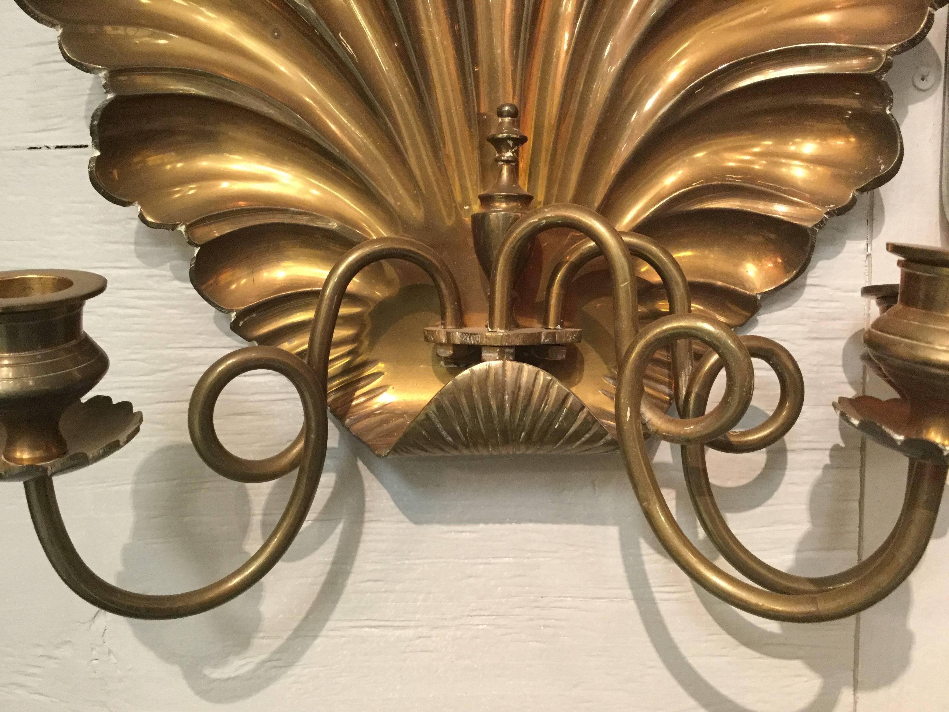 Very well-made and beautifully formed pair of European brass shell sconces, imported by Nora Fenton.