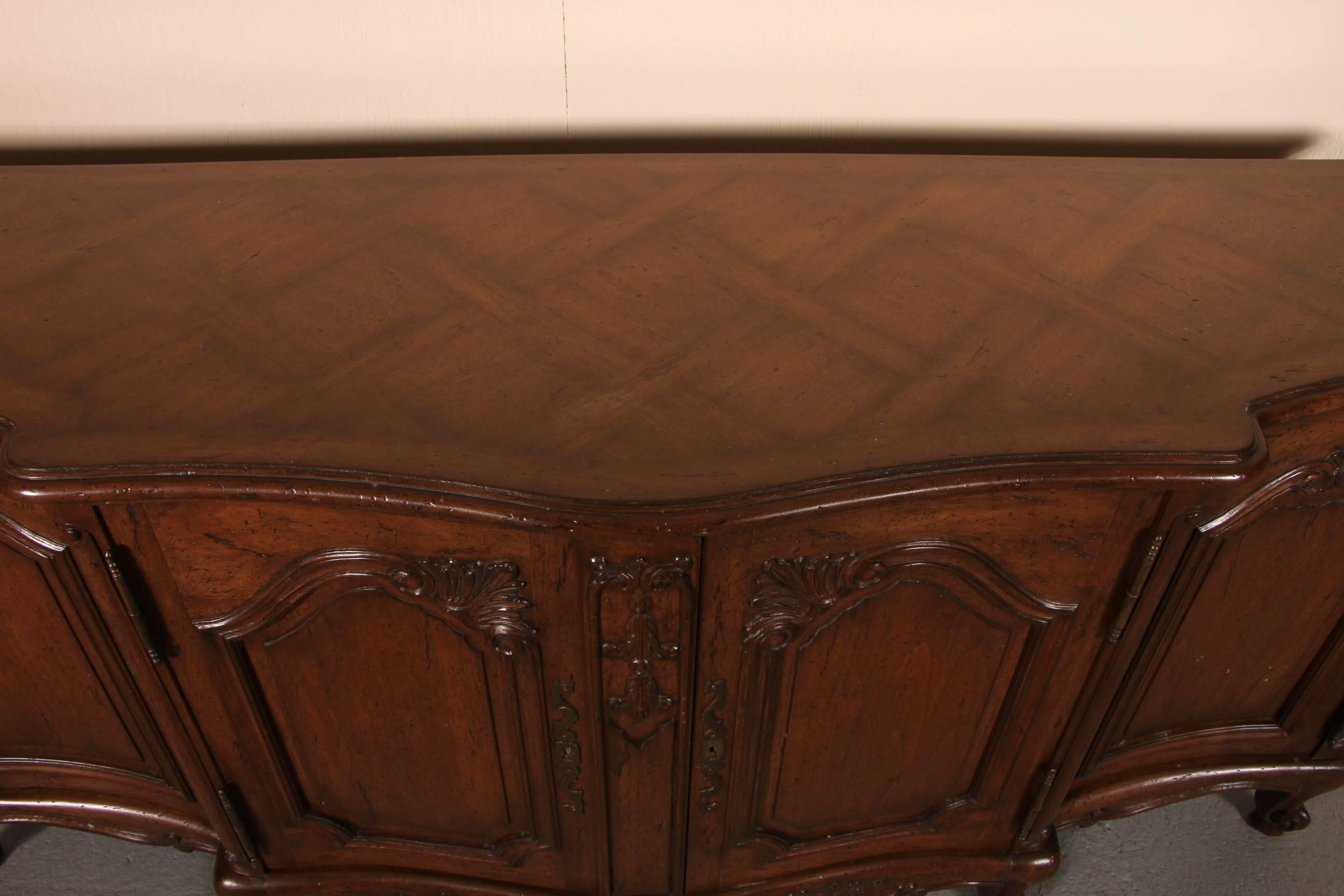 Quality deep stained Country French sideboard with parquetry top, raised snail's head foot, great traditional styling throughput, and intricate key escutcheons.
