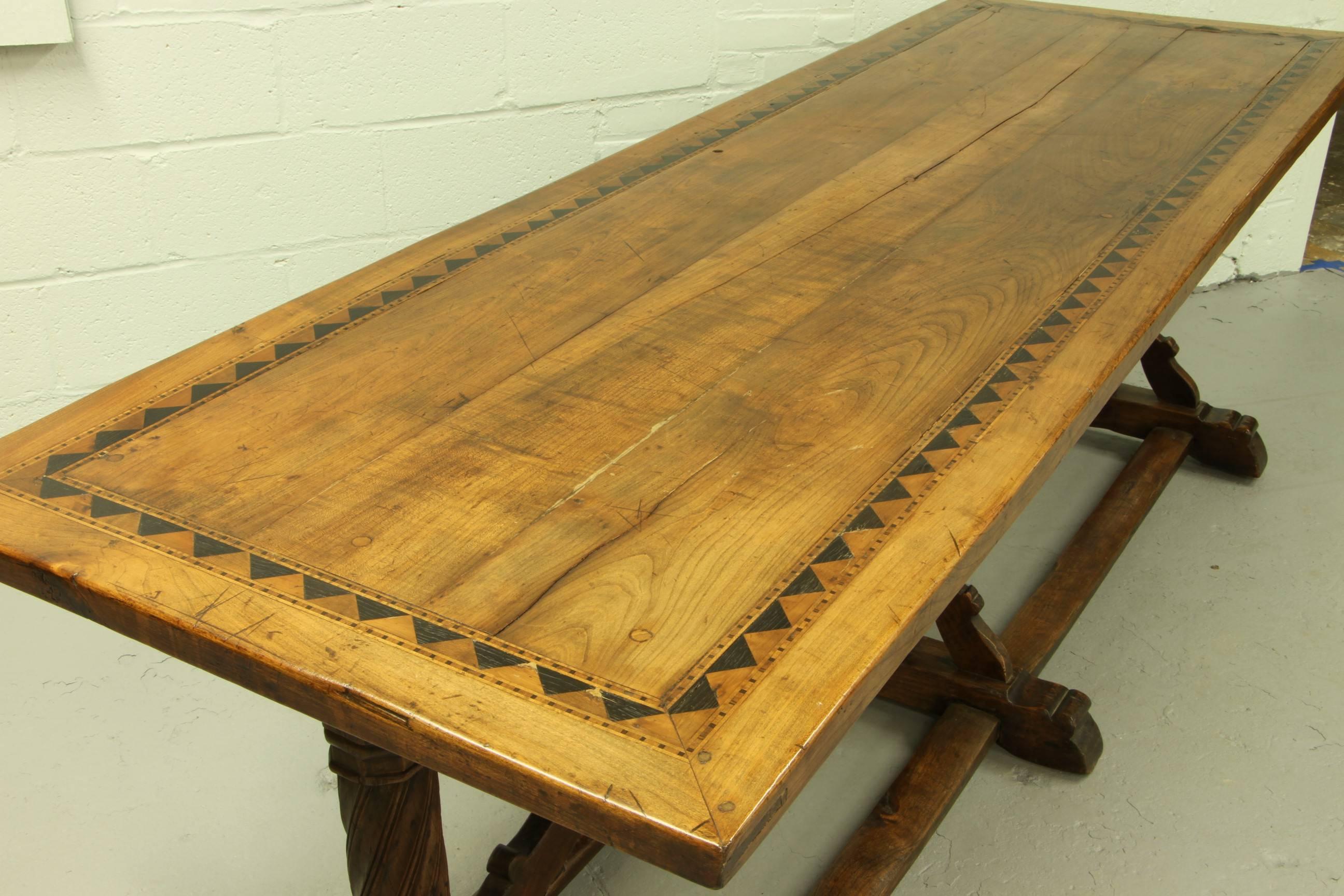 A truly magnificent trestle table with excellent proportions, satinwood and ebony inlaid top, double stretchers and serpentine trestles. There are some old restorations consistent with the age of this great piece. Overall condition is excellent.