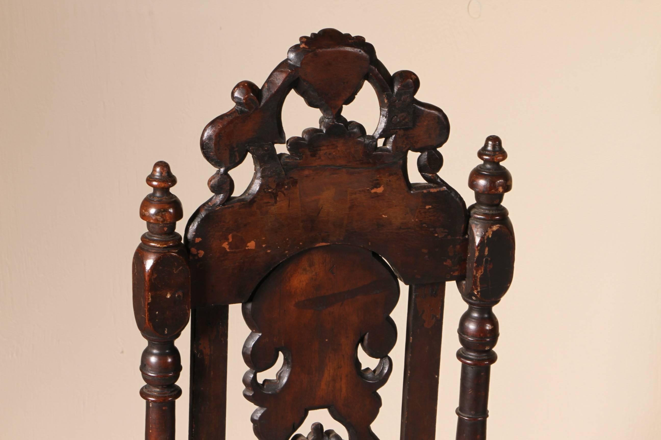 Each with elaborately carved walnut frames with shell and floral pierced back splats, ring turned styles and stretchered base. In very good condition, there is some fading on the velvet seats.