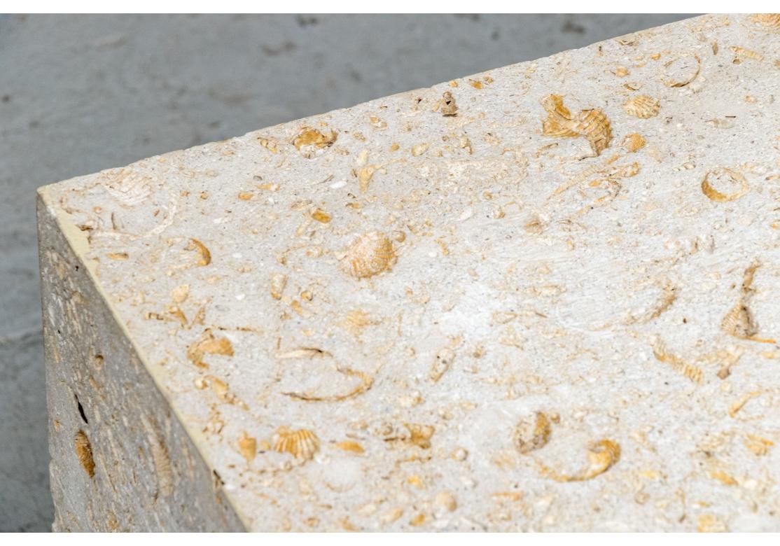 A fine pale interesting travertine stone pedestal base hollow inside. All sides reveal the enclosed shell and sea creature fossils classic for this stone. 

Dimensions: 18 1/2