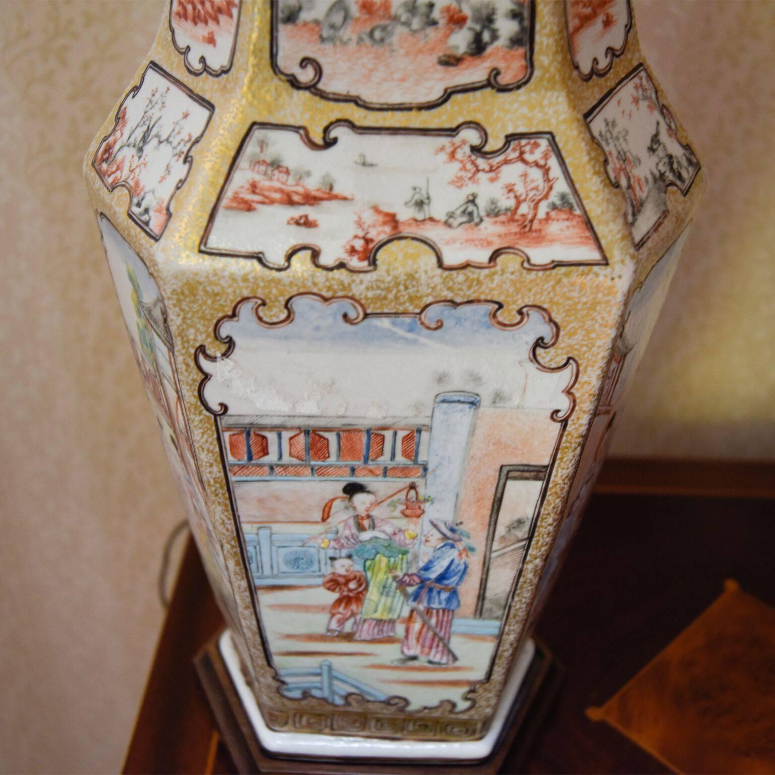 These lovely 19th century Chinese vases that were converted to table lamps are hand-painted with a detailed design of family figures in a home setting surrounded by various bird and outdoor motifs. The vases are colorful with a predominately gold