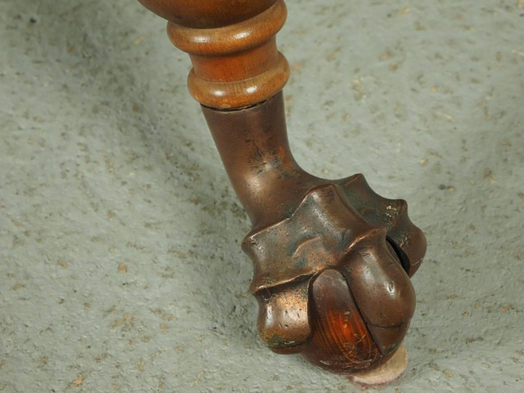 Library table with bold barley twist legs, stylized ball and claw feet with partial brass cap, gadrooned edge.
Condition: Age appropriate wear including some light scratching.