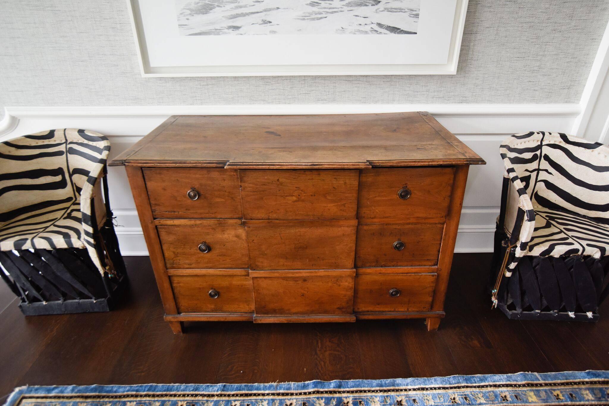 An 18th century French commode. Made from walnut, this three-drawer antique combines timeless form and always-timely storage.