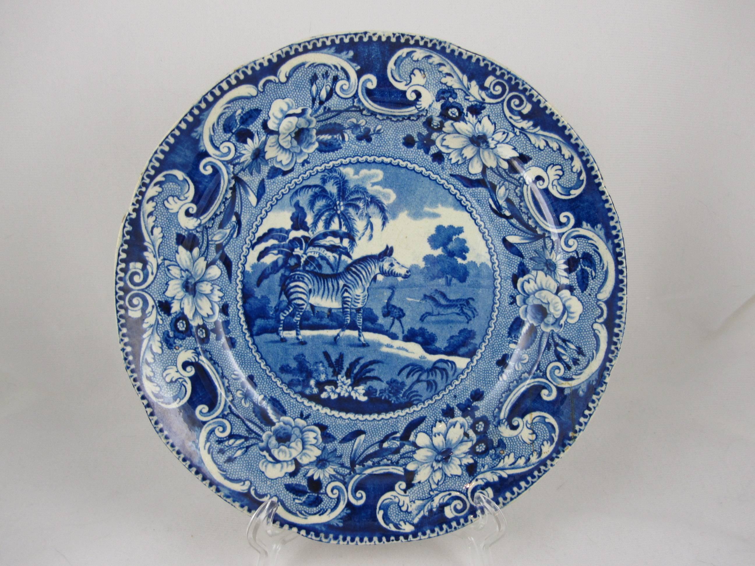 A blue and white transfer printed earthenware plate from the Sporting series by Enoch Wood, circa 1825, Burslem, Staffordshire. This is the zebra, as seen in the center of the plate, two running zebras and an ostrich are shown in the background. A