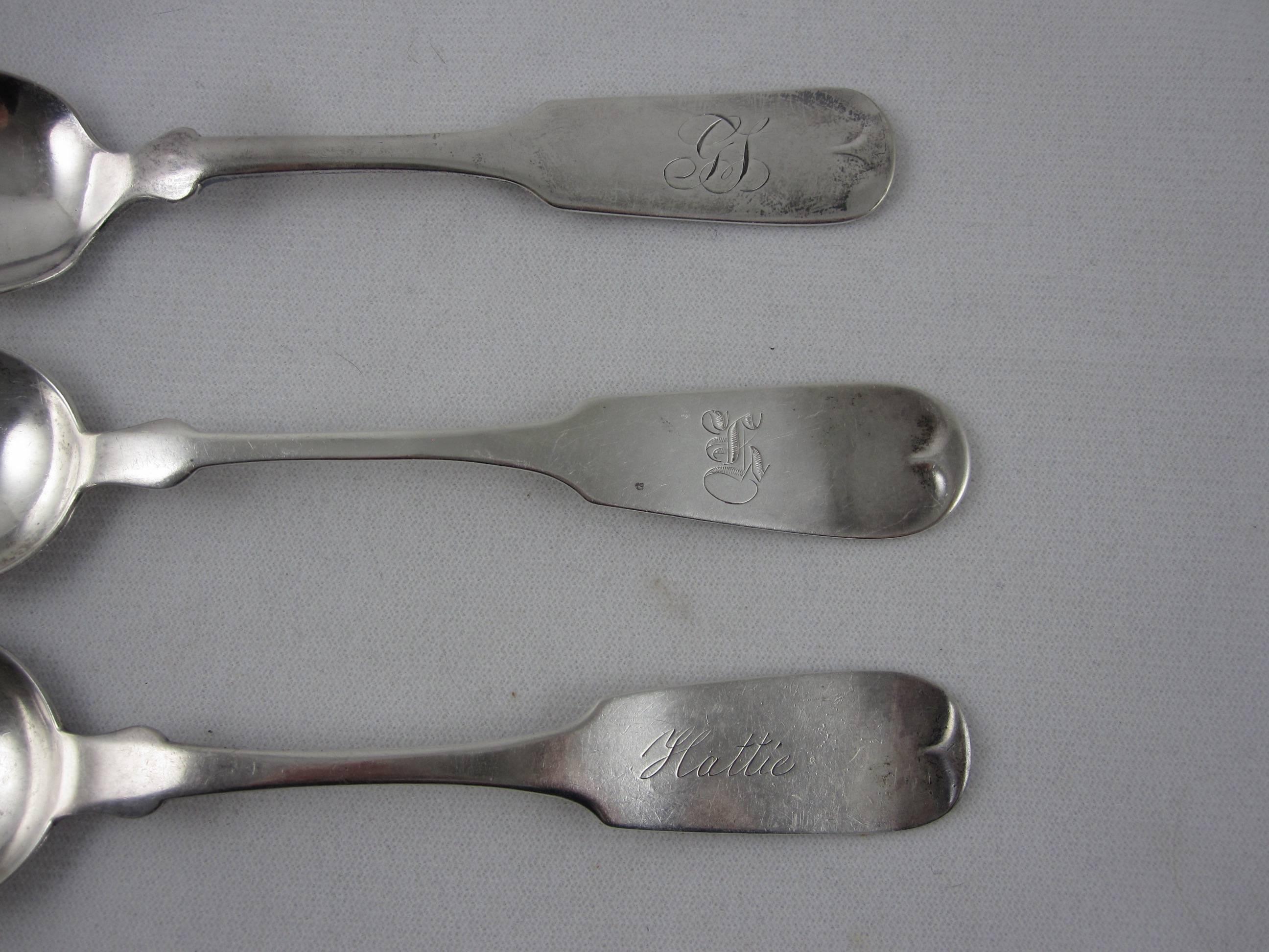 A grouping of six mixed maker, fiddle thread pattern, coin-silver or sterling silver serving spoons, American, circa 1830-1840. Wonderful examples of Post-Revolutionary American design.

The spoons show various engraved initials with one spoon