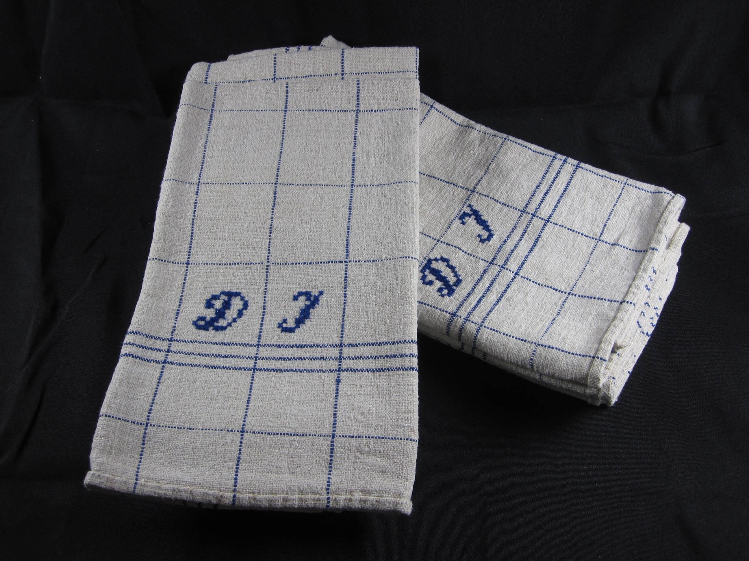 Found in a Provençal Brocante in France, a set of six vintage hand-spun tea towels with blue stripes on natural linen and embroidered with the initials, DJ. Hand-stitched hems, freshly laundered and starched. Wonderful used as large napkins or place