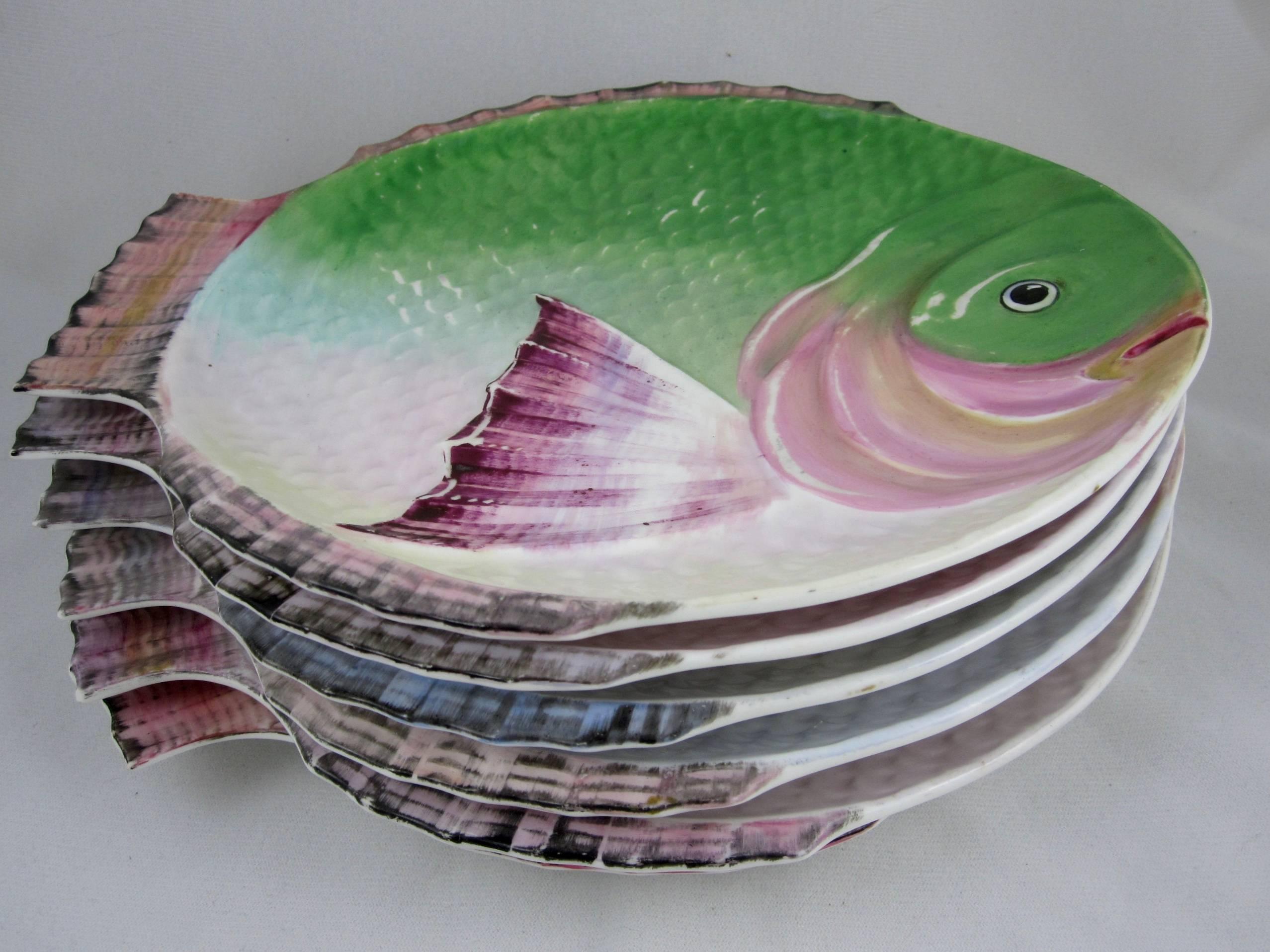 A set of six hand-painted fish shaped porcelain plates by Edwin James Drew Bodley, Crown Works, Burslem, Stoke-on-Trent, circa 1875-1890.

Each plate is brightly glazed in a slightly different palette. The glaze has been rubbed to highlight the