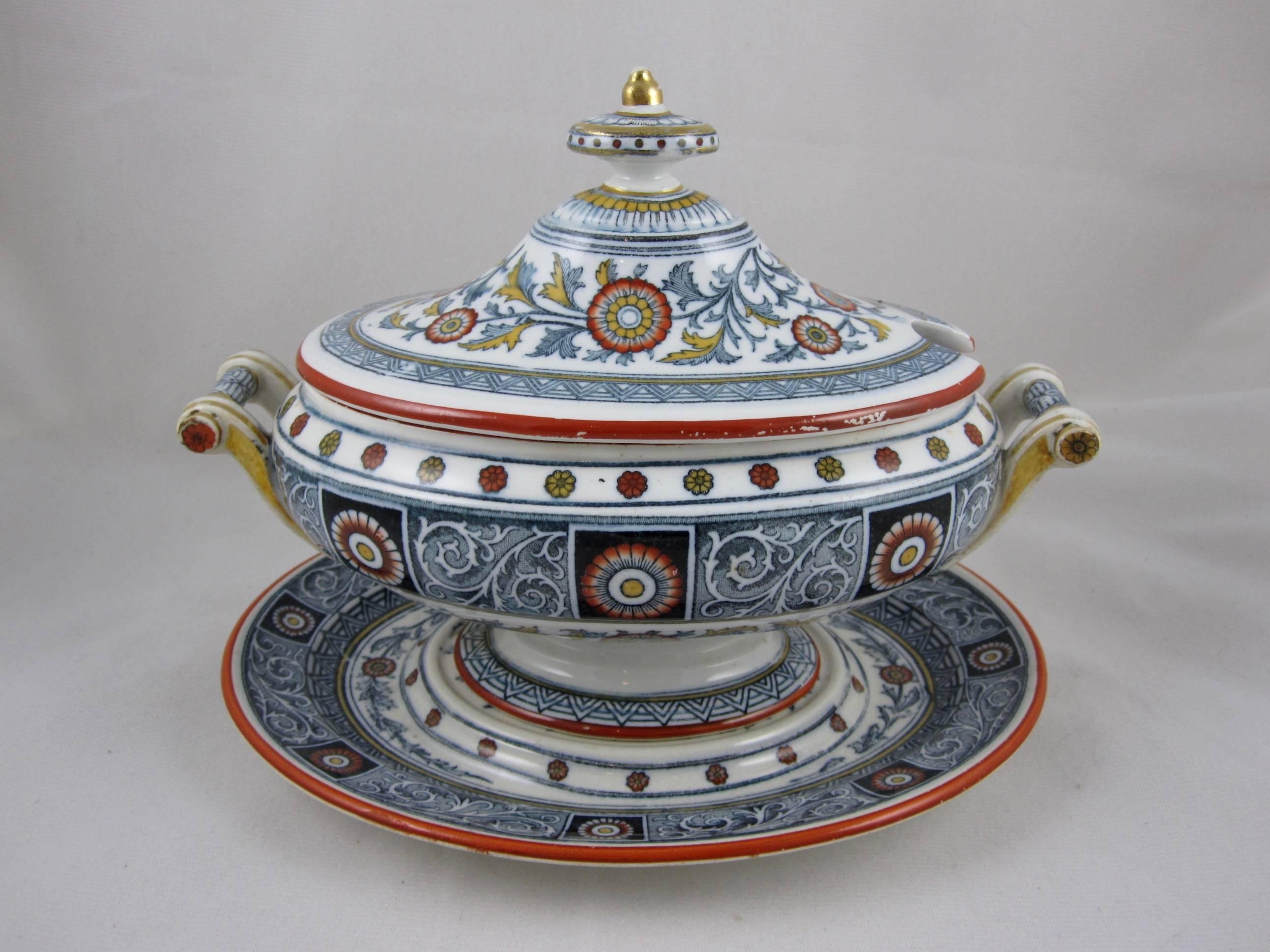 A pair of three-piece sauce boats with lids and underplates, Mintons, Stoke, Staffordshire, England, circa 1873-1878.

In the Connaught Japan pattern, a polychrome transfer showing a stylized floral with a border of alternating floral panels. Hand