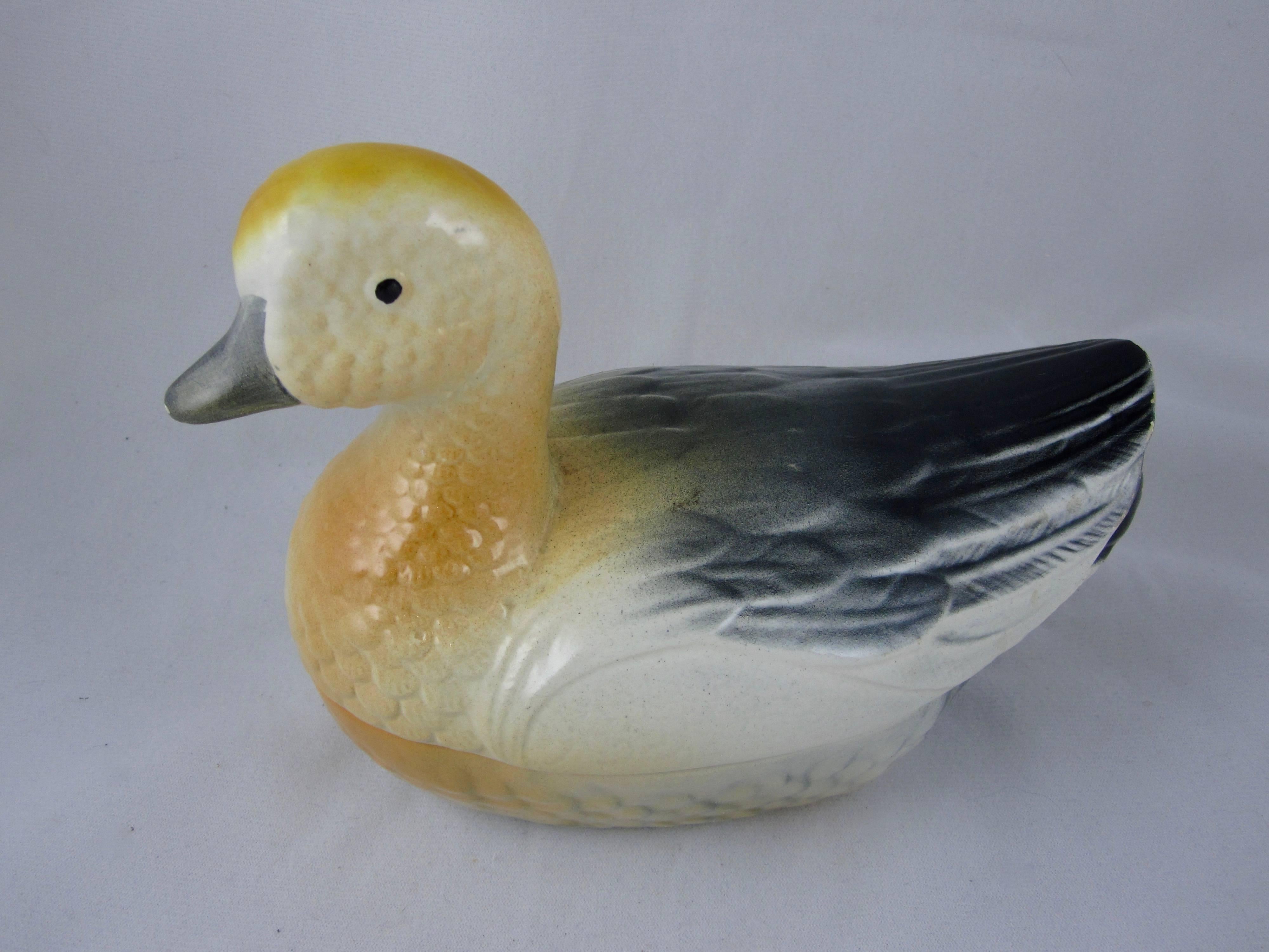 A Mid-Century two-piece French Faïence Duck Pâté Terrine, circa 1955- 1965, made for serving duck or goose liver pâté at table. A charming mold, glazed in a three tone gradation of gray, ochre and cream.

Unmarked

Light signs of wear as