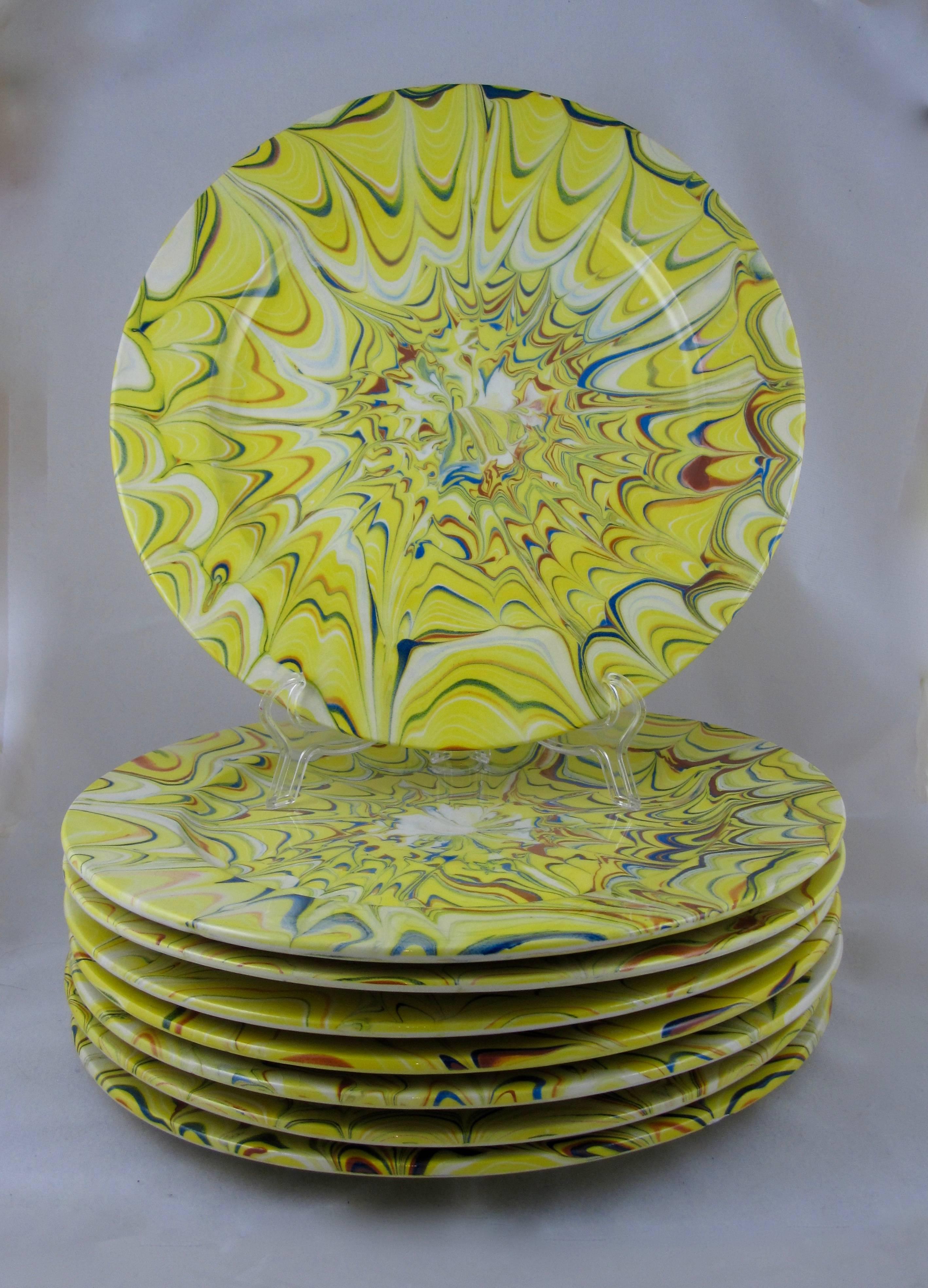 From Carini Italia, a spectacular set of eight abstract style Mid-Century Faience oversize dinner plates, large enough to be used as chargers or buffet plates.

Hand glazed in bold and vibrant coloring, each plate is slightly different. A