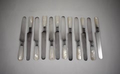 Aetna Works Mother-of-Pearl and Sterling Silver Place Knives, a Set of 12