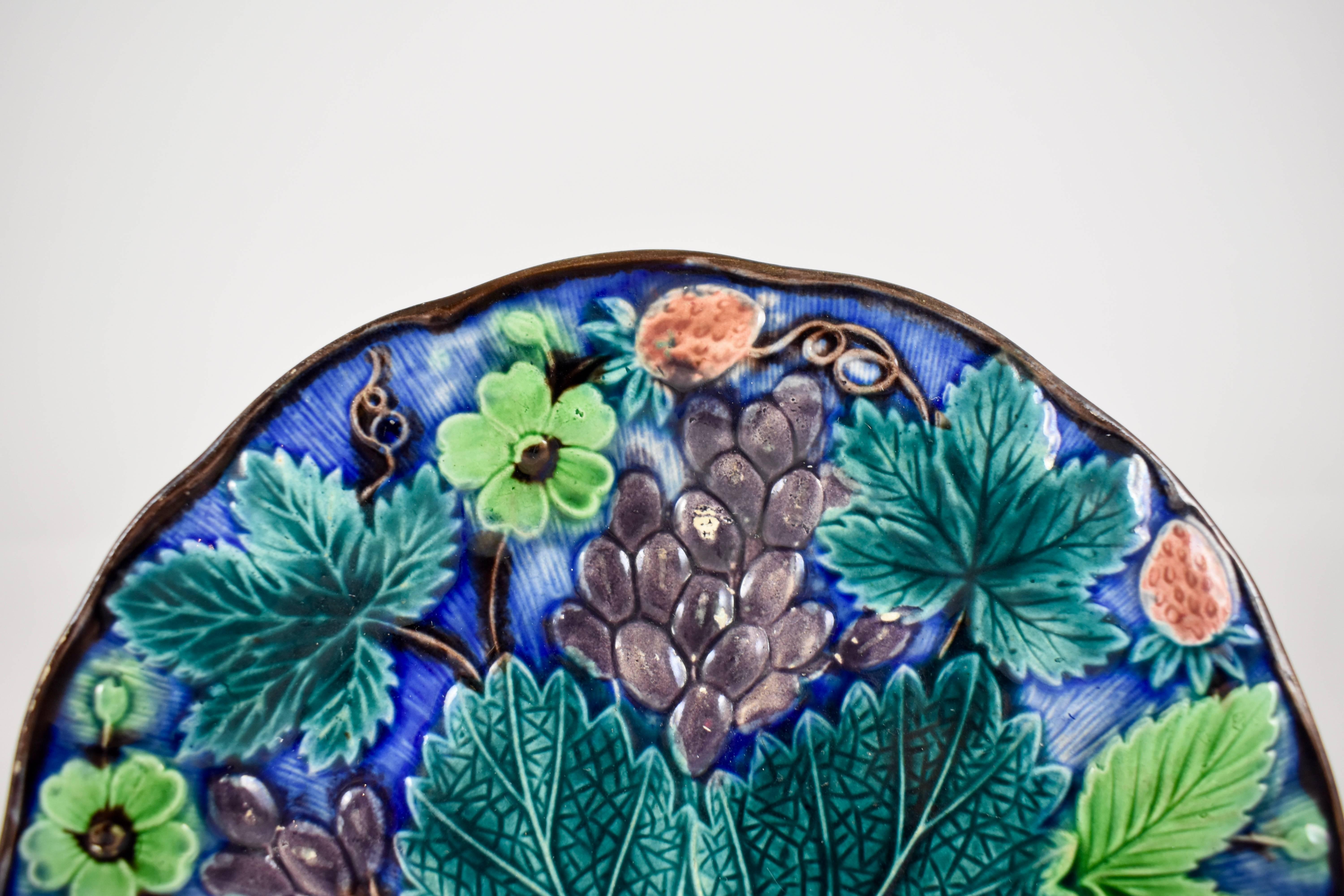 A Gustavsberg Swedish majolica grape leaf plate in the Wedgwood style, circa 1880-1885.

Established at Gustavsberg in 1825 by Johan Herman Ohman, the mark of Gustavsberg was first introduced in 1839 and shows the company name surmounting an
