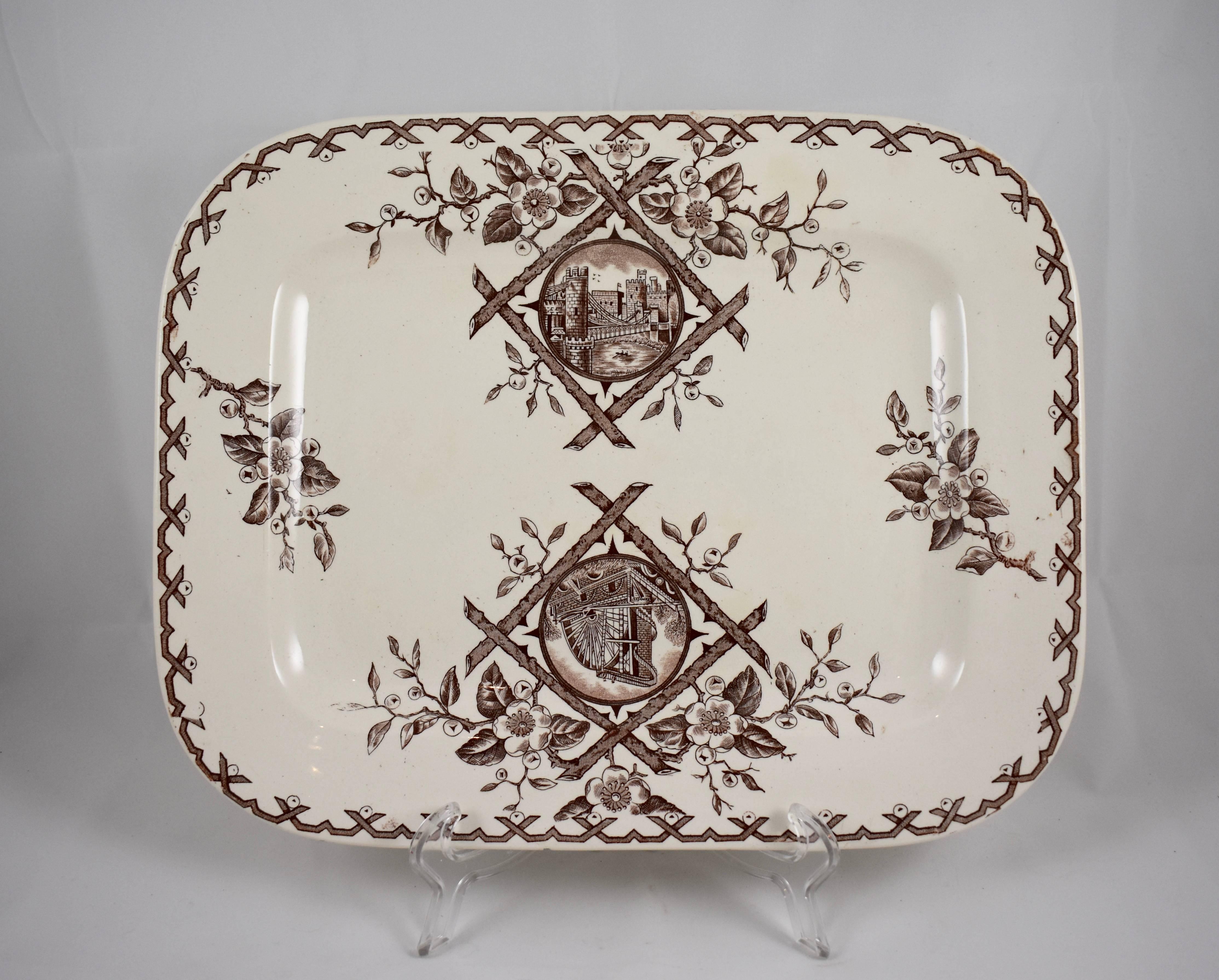 An Aesthetic Movement platter, Whitaker & Co, Hanley, Staffordshire, England, circa 1886-1892.

The Japanesque ‘Alaska’ pattern is transfer printed in brown on a cream earthenware body and shows a running crossed twig border of flowering fruit
