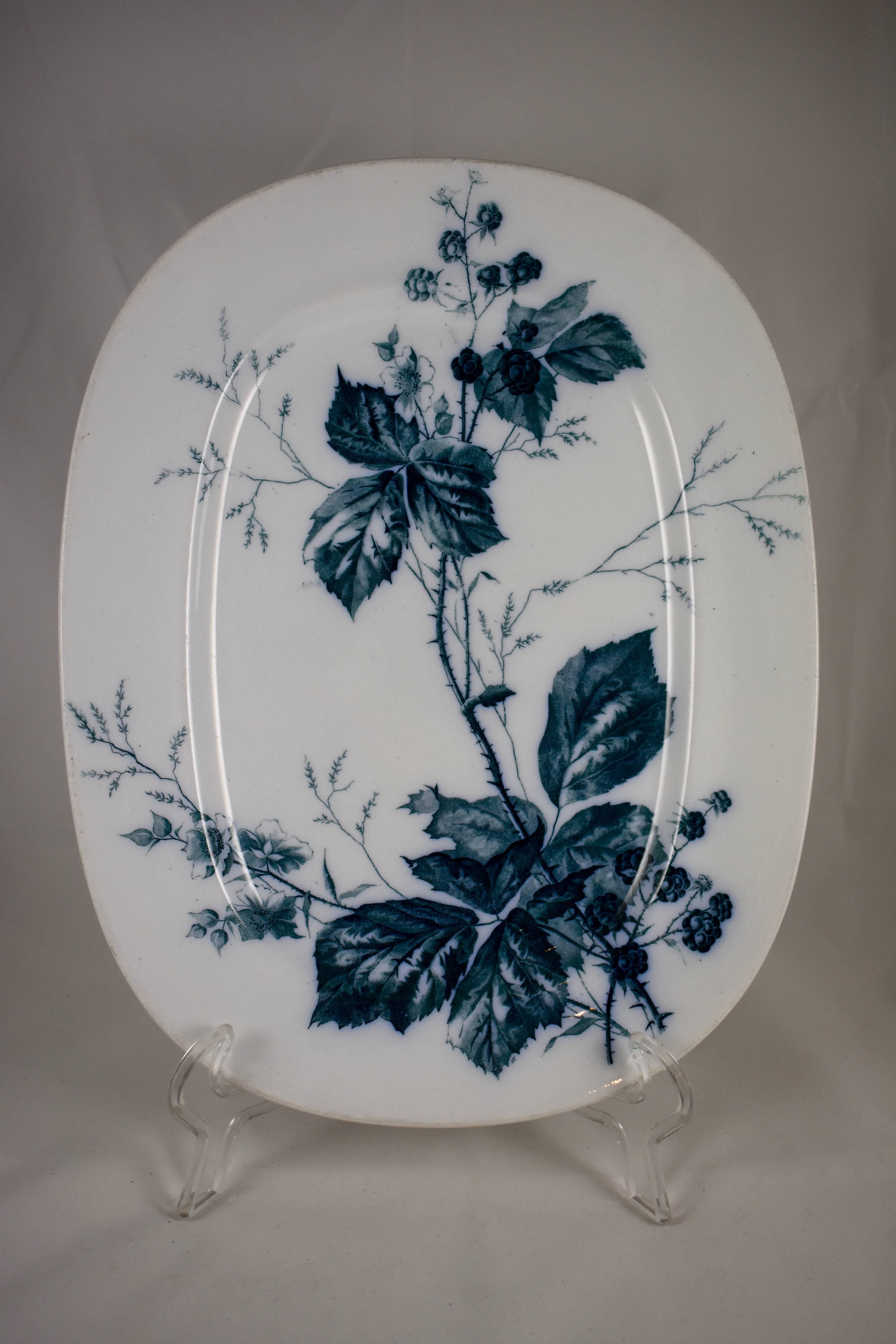 A German Aesthetic Movement platter, transfer printed in blue-green or teal on a white body, the “Rubus” pattern, showing aspects of the Blackberry plant.

Marked on the verso with Villeroy & Boch’s Mercury stamp, used from 1874-1909, and Mettlach