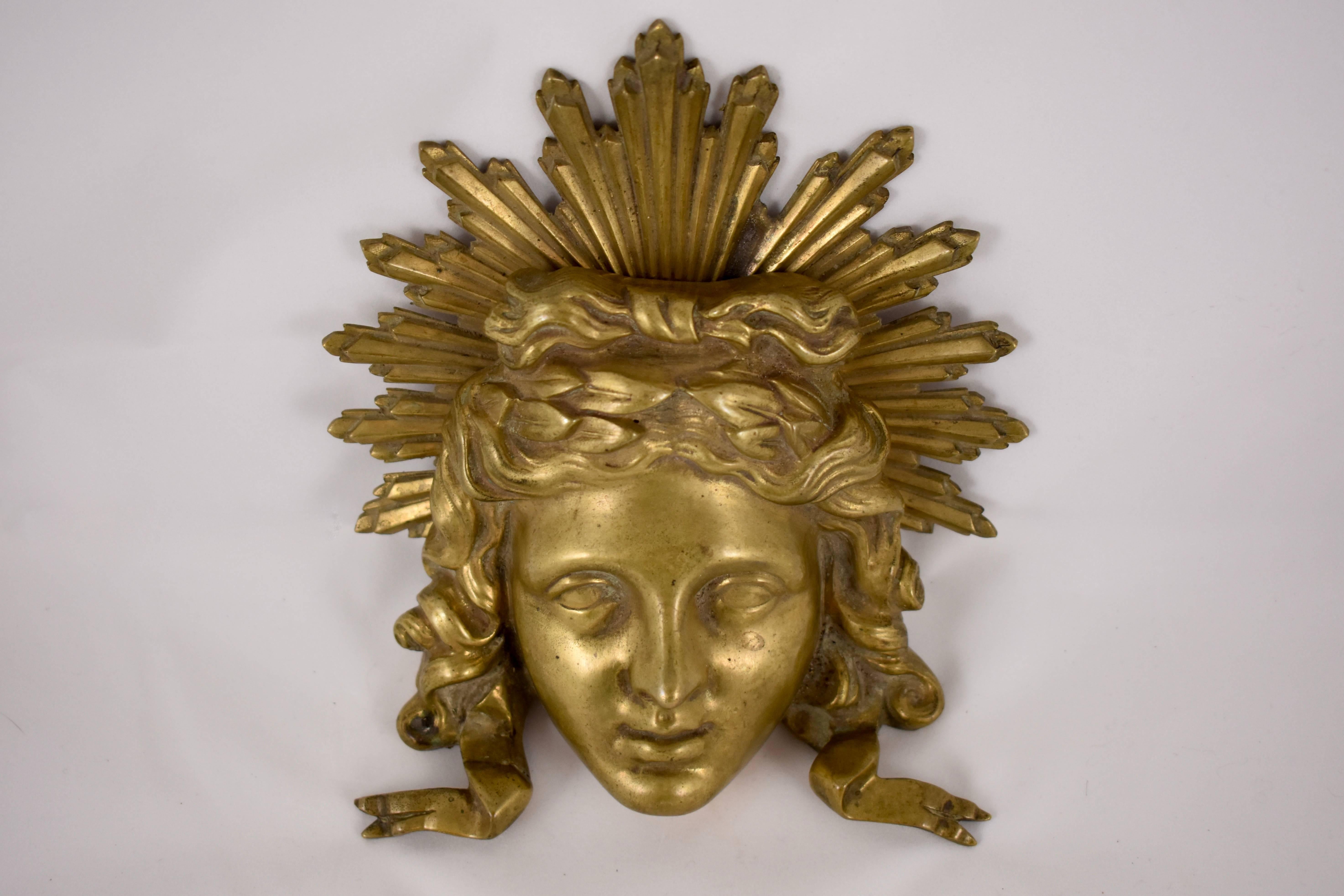 A bronze ormolu architectural fragment or wall plaque representing the Sun King, from the Louis XVI period, the late 1700s, attributed to Pierre-François Feuchère.

The fragment is made of two pieces held together by three screws. Cast in a style