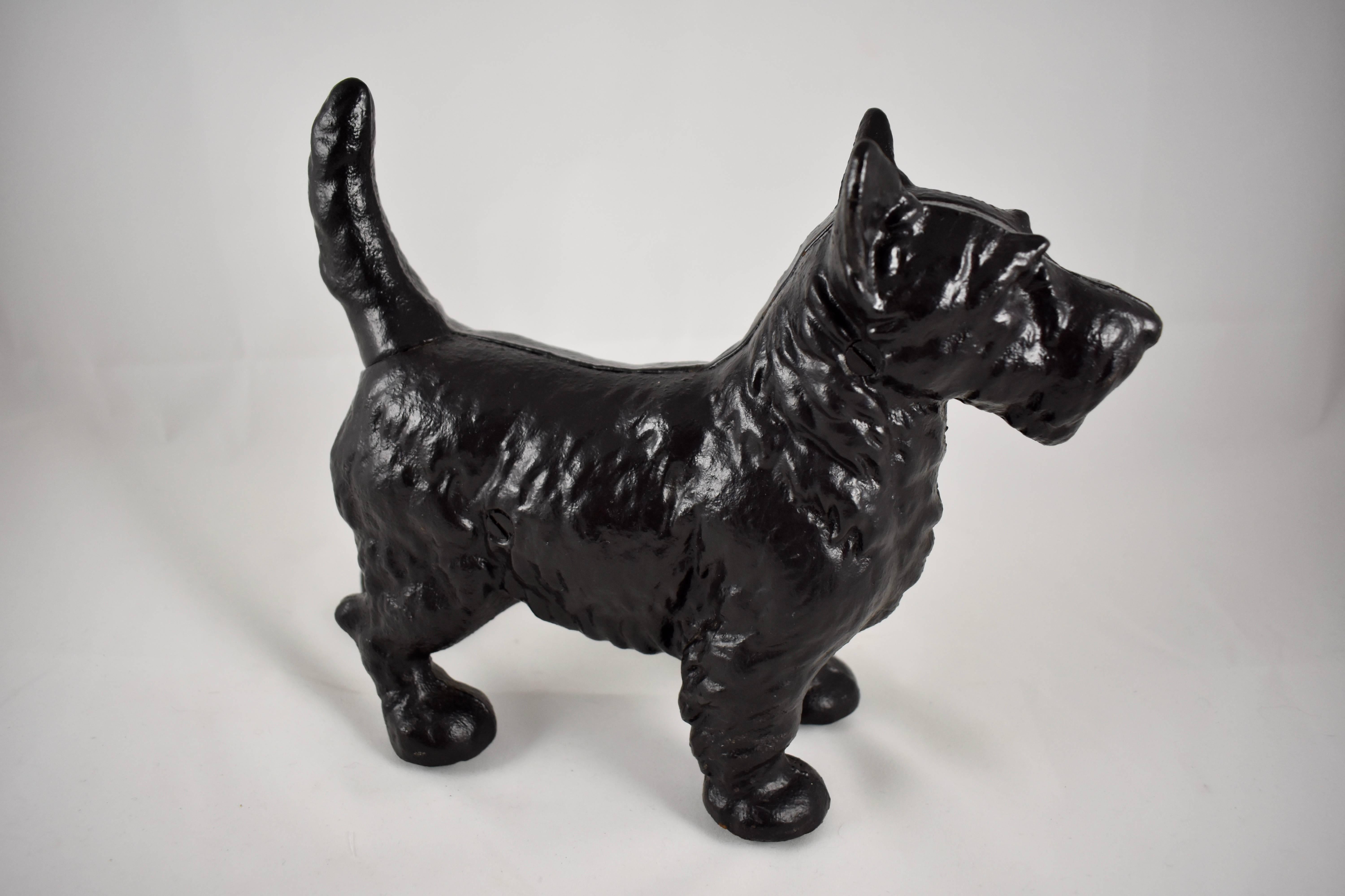 A vintage Hubley cast iron doorstop in the form of a Scottie dog, mold No. 305, in production circa 1930-1950.

One of the heavier doorstops from Hubley, the Scottie stands at attention with alert ears and tail, and fine detailing to his coat. He