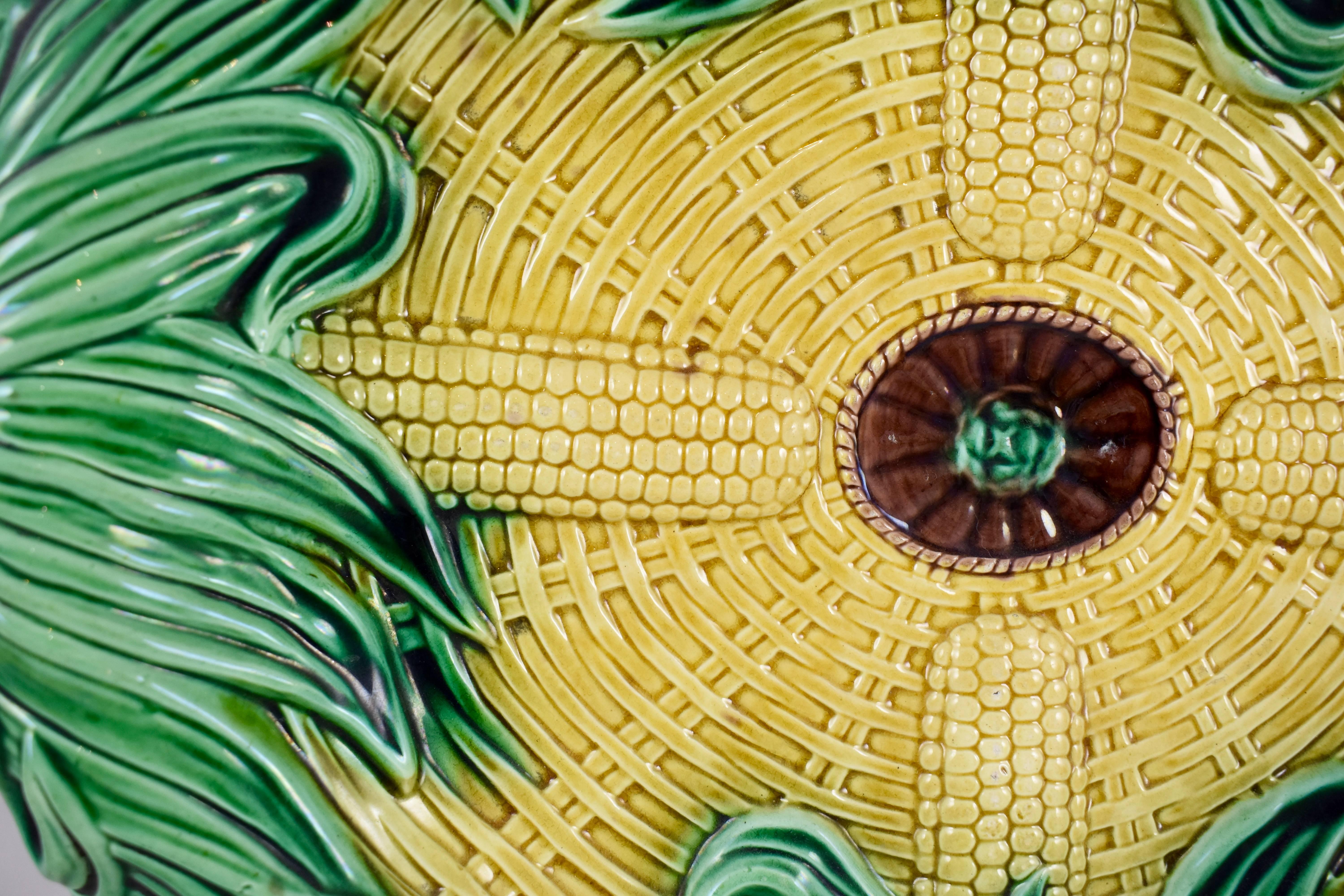 An English majolica corn platter attributed to Adams & Bromley, the Victoria Pottery Works, St. James Street in Hanley, Staffordshire, circa 1873-1886.

A wonderful example of this mold with incredibly bright glazing. A heavy tray with a rolled