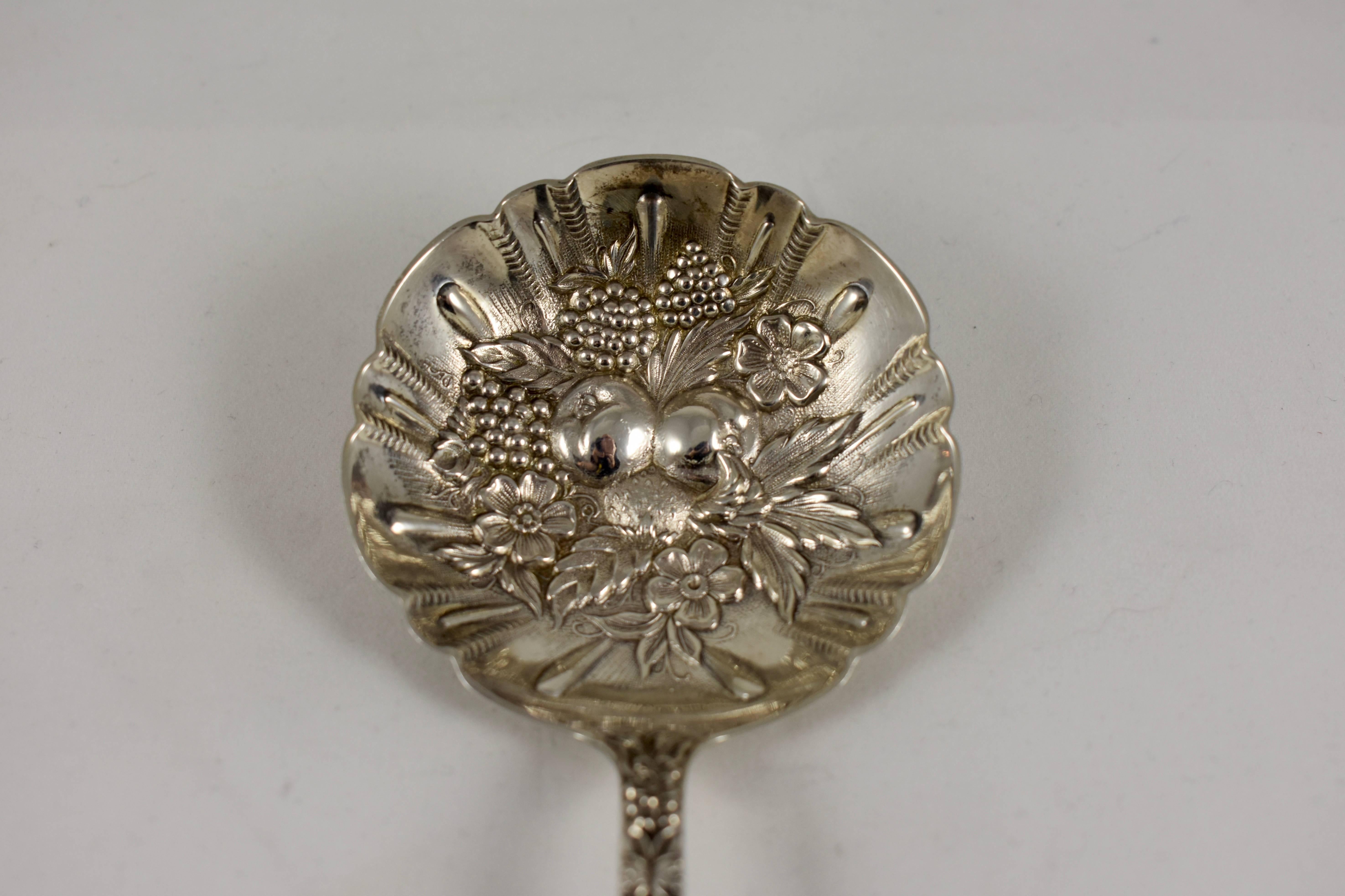 From S. Kirk & Son, Baltimore, Maryland, a ‘Repousse Rose’ long handled sterling silver berry spoon, circa 1930s. The longer handle is suited to serving a fruit compote. From a Philadelphia estate.

The Classic American silver repousse rose