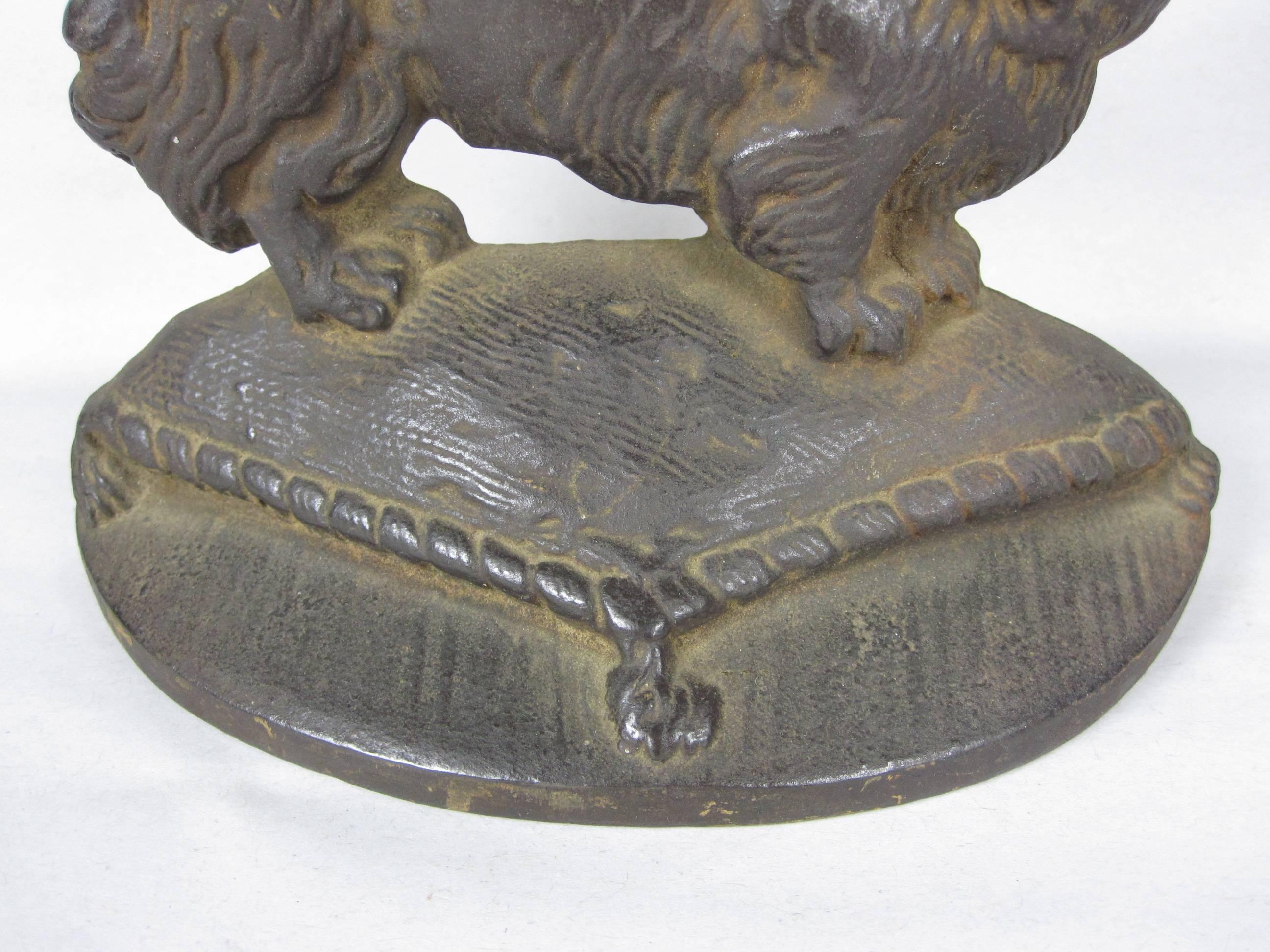 American 19th Century John Hubley Cast Iron Pekinese Dog Bookends / Door Stops, a Pair