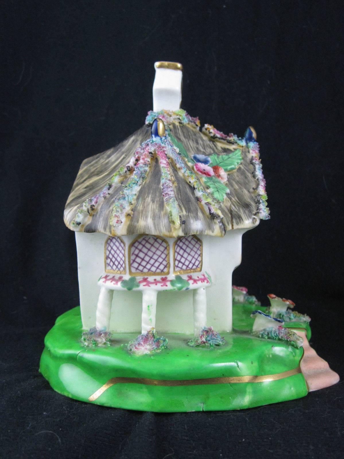 
 A charming mid-1800s Staffordshire incense or pastille burner shaped as a country cottage with a thatched roof.

Provenance: From the Pittsburgh, Pa. estate of Richard Mellon Scaife.

Pastille burners were commonly used in the 19th century