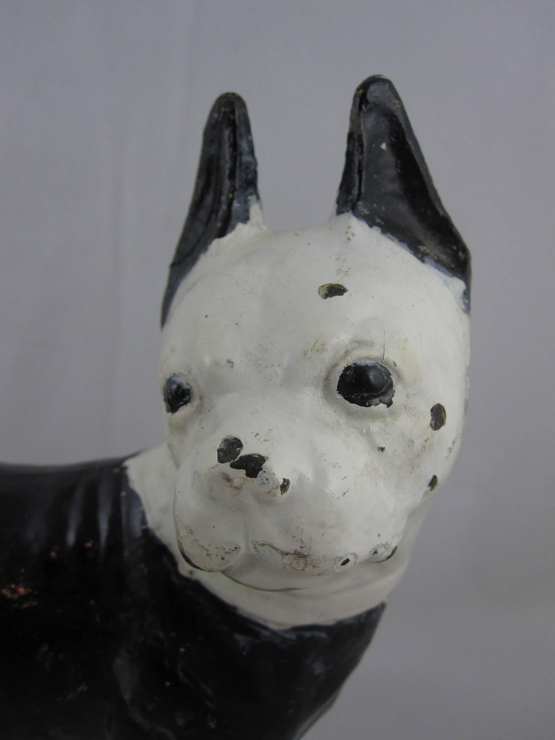A Hubley cast iron doorstop, a French bulldog, enameled in black and white, circa early 1900s. This form shows the true to breed stance and the great expression Hubley dogs are known for. The Hubley Manufacturing Company was first incorporated in