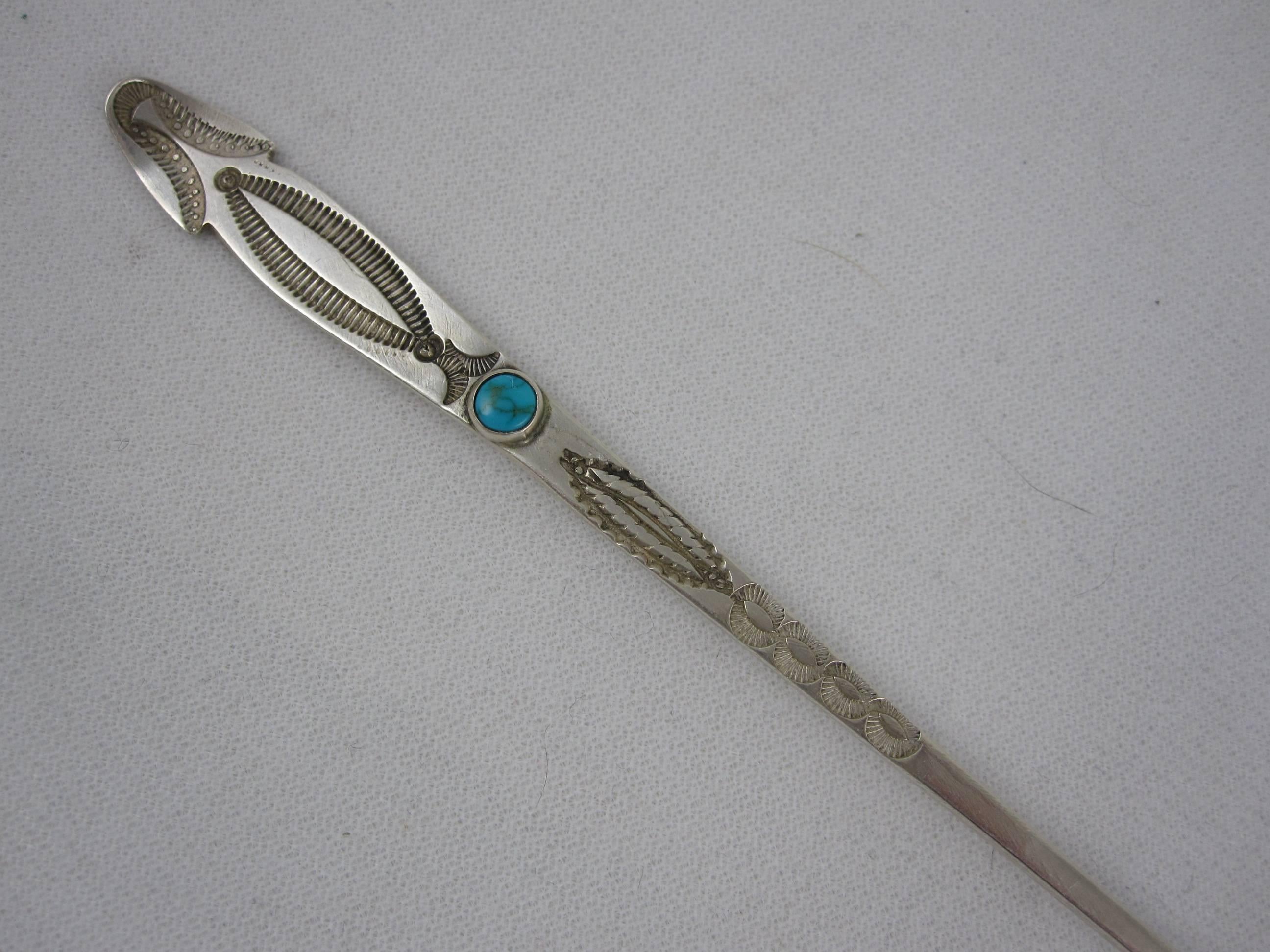 A vintage set of four, long handled sterling silver iced tea stirring spoons with stamped Native American - Southwestern decoration and beveled set, cabochon cut turquoise. The set is four ounces total weight.

 Tested as sterling,