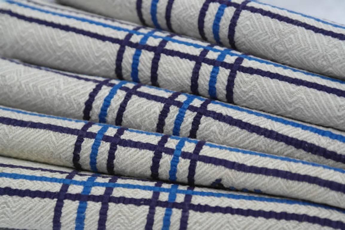 Found in a Provençal Brocante in France, a set of six vintage monogramed napkins, typically French. Fine natural linen is woven in a geometric jacquard with contrasting French Blue and Royal Blue stripes and the hand embroidered initials, LBC.
