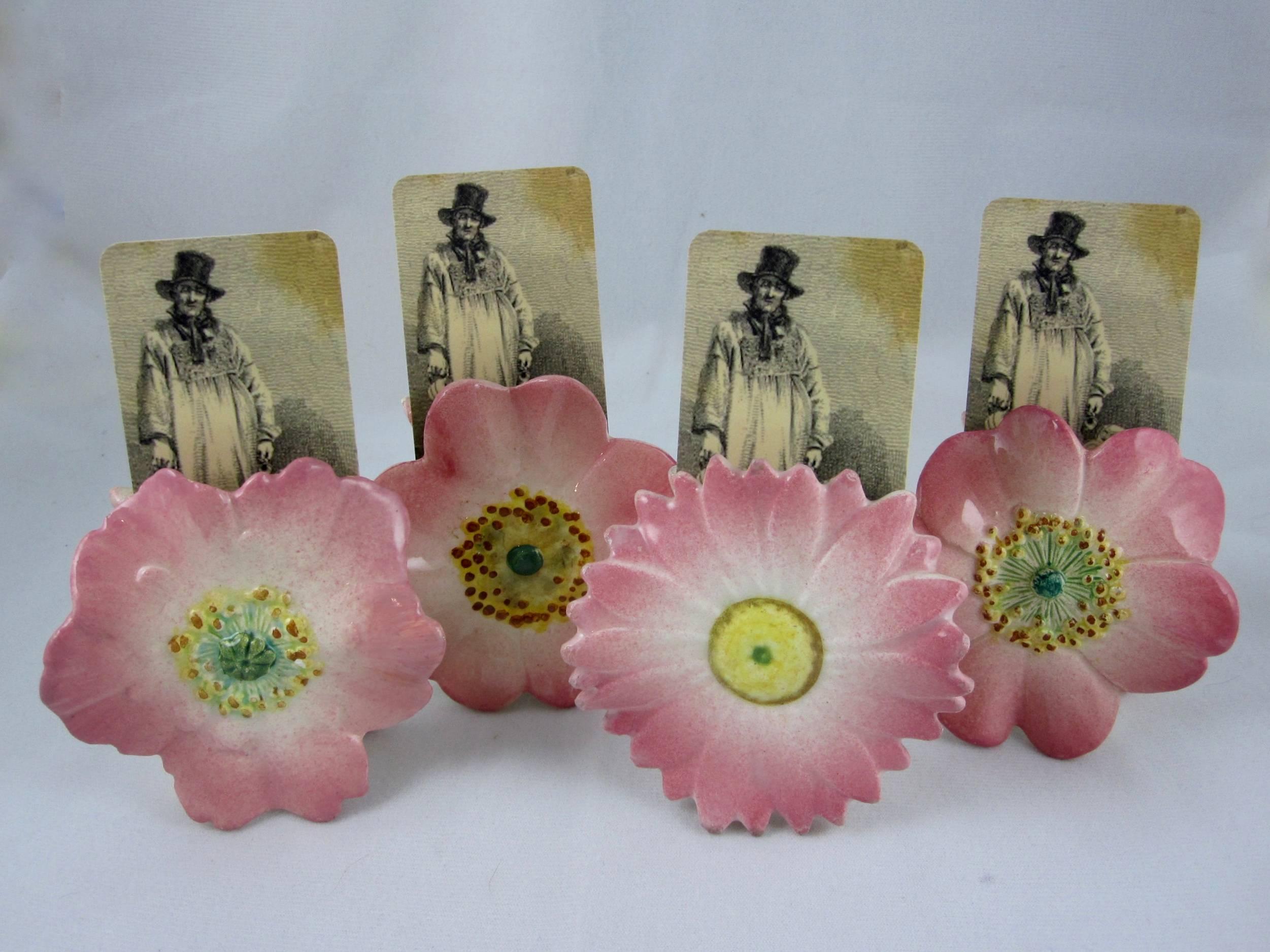 A set of four decorative flower menu holders by Delphin Massier (1836-1907), Vallauris, Cote d’Azur, France, circa 1890. Made to sit on the table to present le menu du dîner. They work beautifully as place card holders at each plate as well.

The