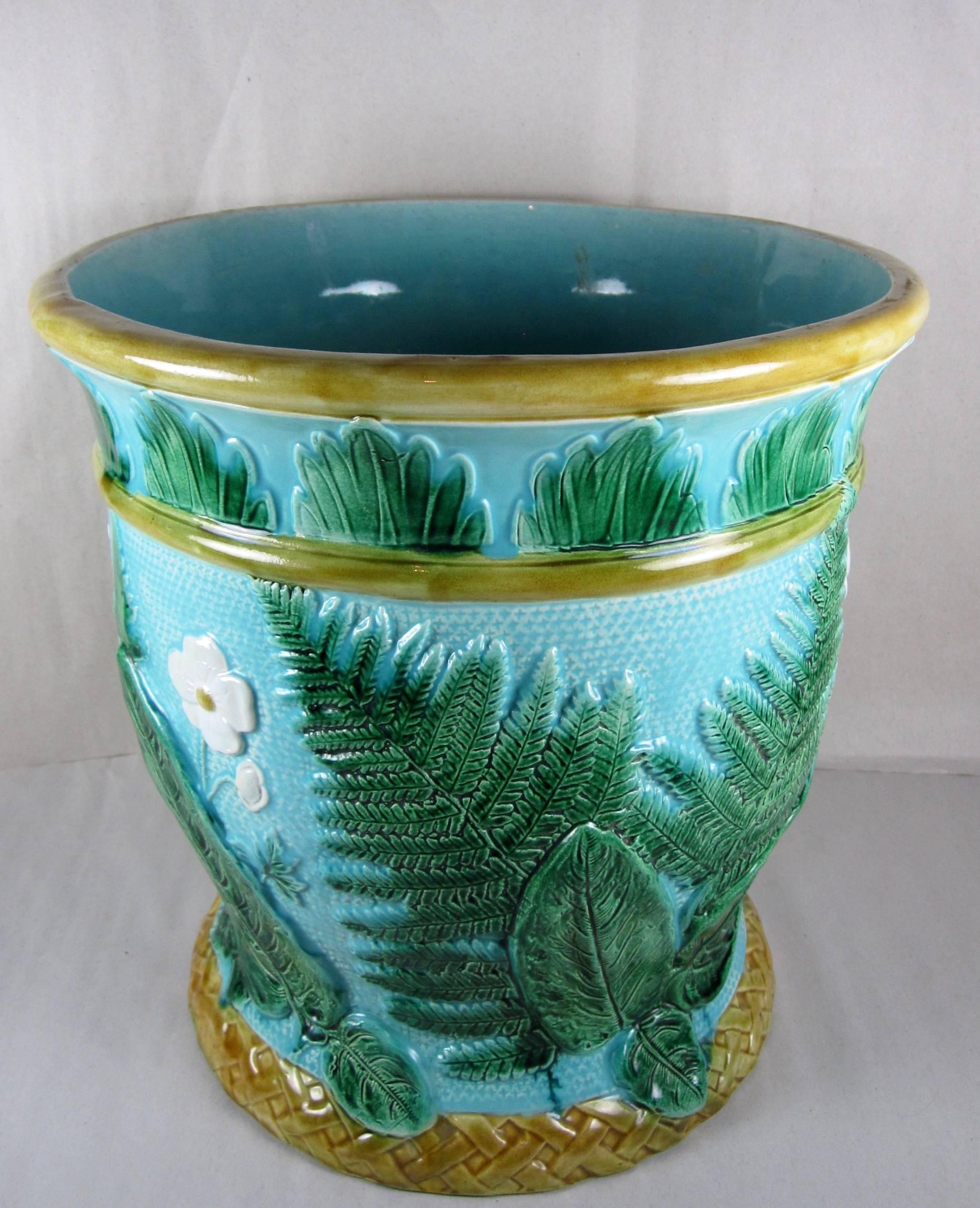  An oversized John Adams & Co., later known as Adams & Bromley, English majolica jardinière with a leaf, fern and floral theme, manufactured in 1871. This piece would have been at home in a Victorian English Garden Conservatory.

 Brightly colored